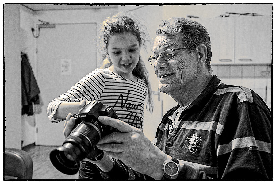 Tamron SP AF 17-50mm F2.8 XR Di II LD Aspherical (IF) sample photo. Grand dad looking at the pictures my daughter took. photography