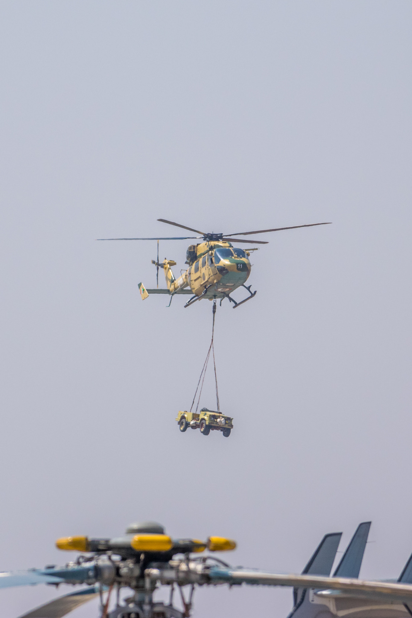 Nikon D5300 + Nikon AF-S Nikkor 200-500mm F5.6E ED VR sample photo. Helicopter lifting an army vehicle at aero india 2017 photography