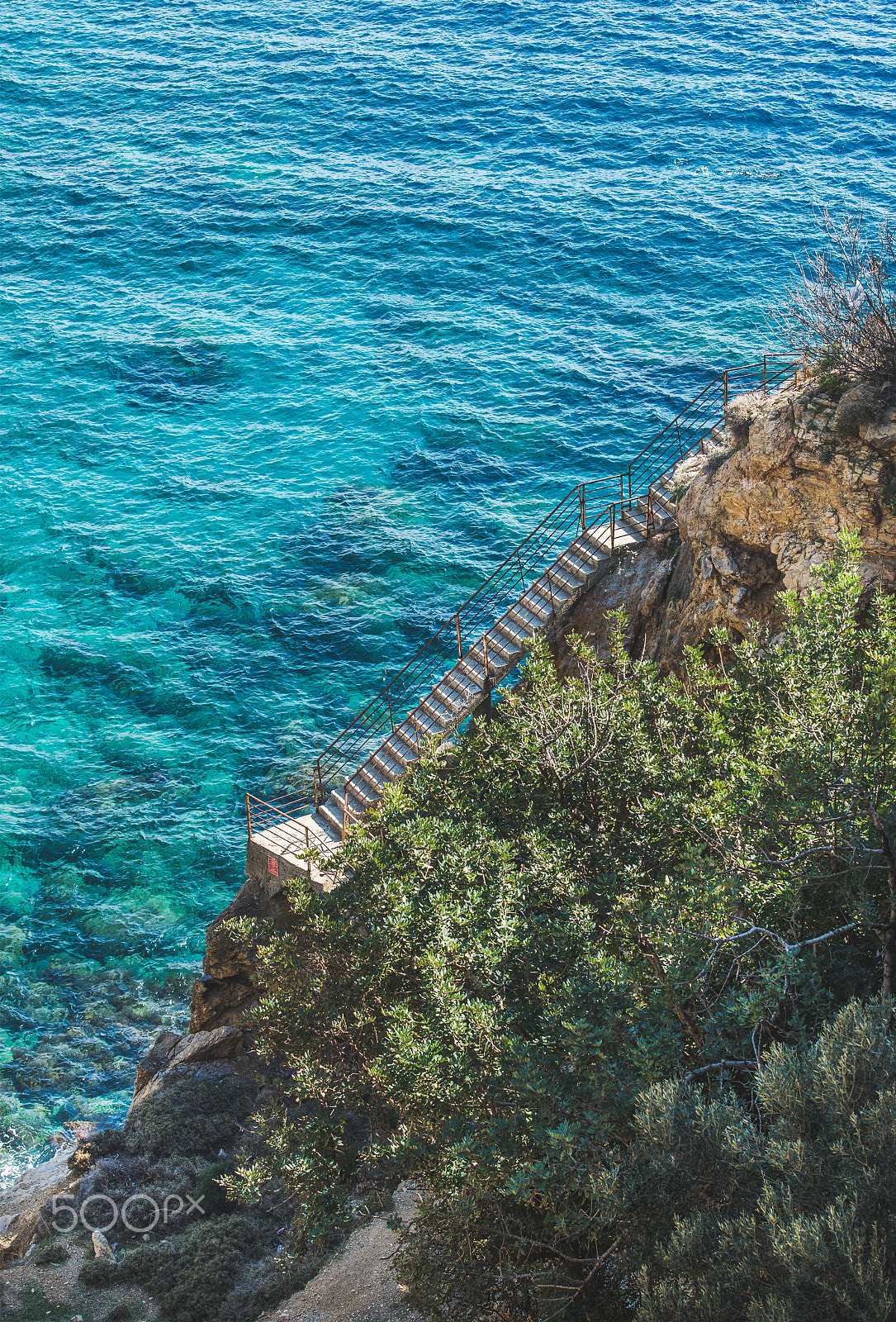 Nikon D610 sample photo. Stairs leading down to lagoon and turquoise sea waters, turkey photography