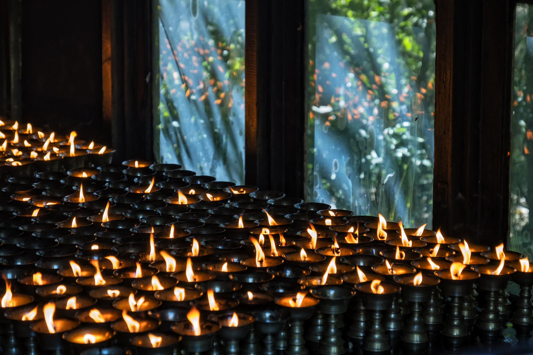 Fujifilm X-T2 + Fujifilm XF 18-135mm F3.5-5.6 R LM OIS WR sample photo. Oil candles in lumbini photography
