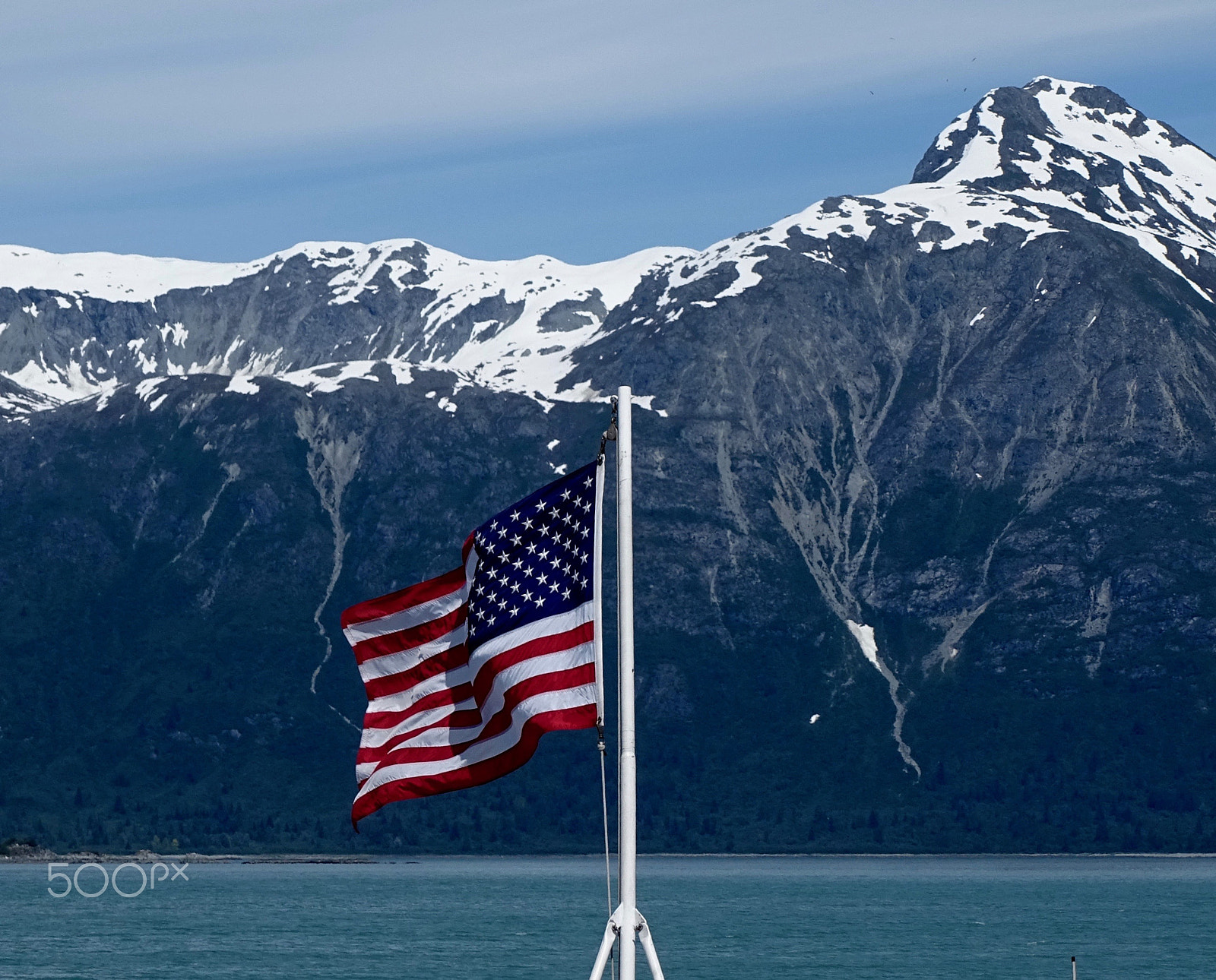 Sony 24-210mm F2.8-6.3 sample photo. American flag & snow capped mountains photography