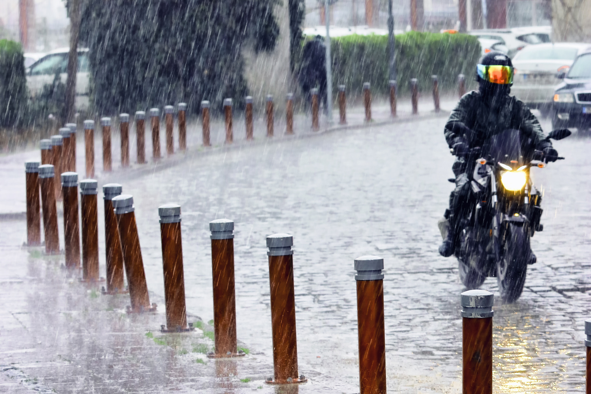Canon EOS 80D + Canon EF 70-200mm F4L IS USM sample photo. Heavy rain photography