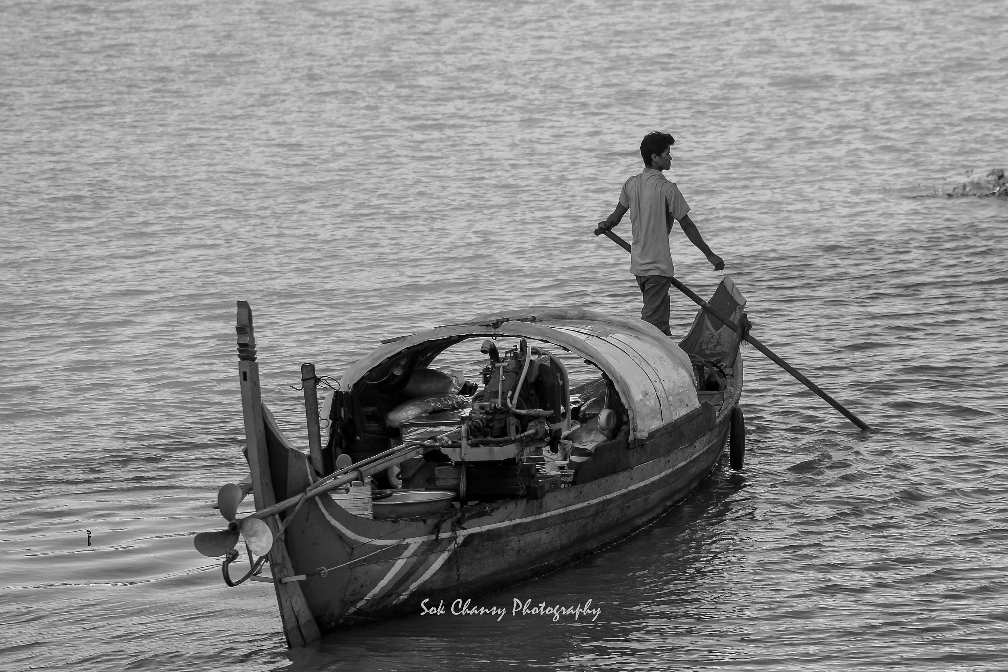 Canon EF 75-300mm f/4-5.6 USM sample photo. Fisherman rowing his boat along mekong river, phnom penh city, cambodia! photography