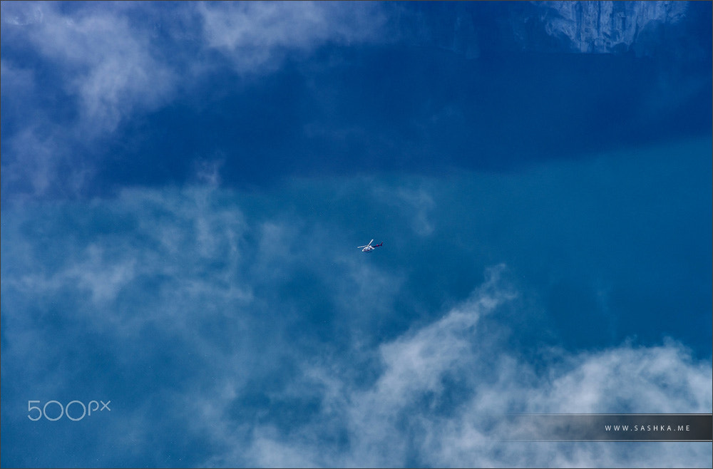 Sony a99 II + Minolta AF 80-200mm F2.8 HS-APO G sample photo. Overview to the small helicopter flying over the lake photography