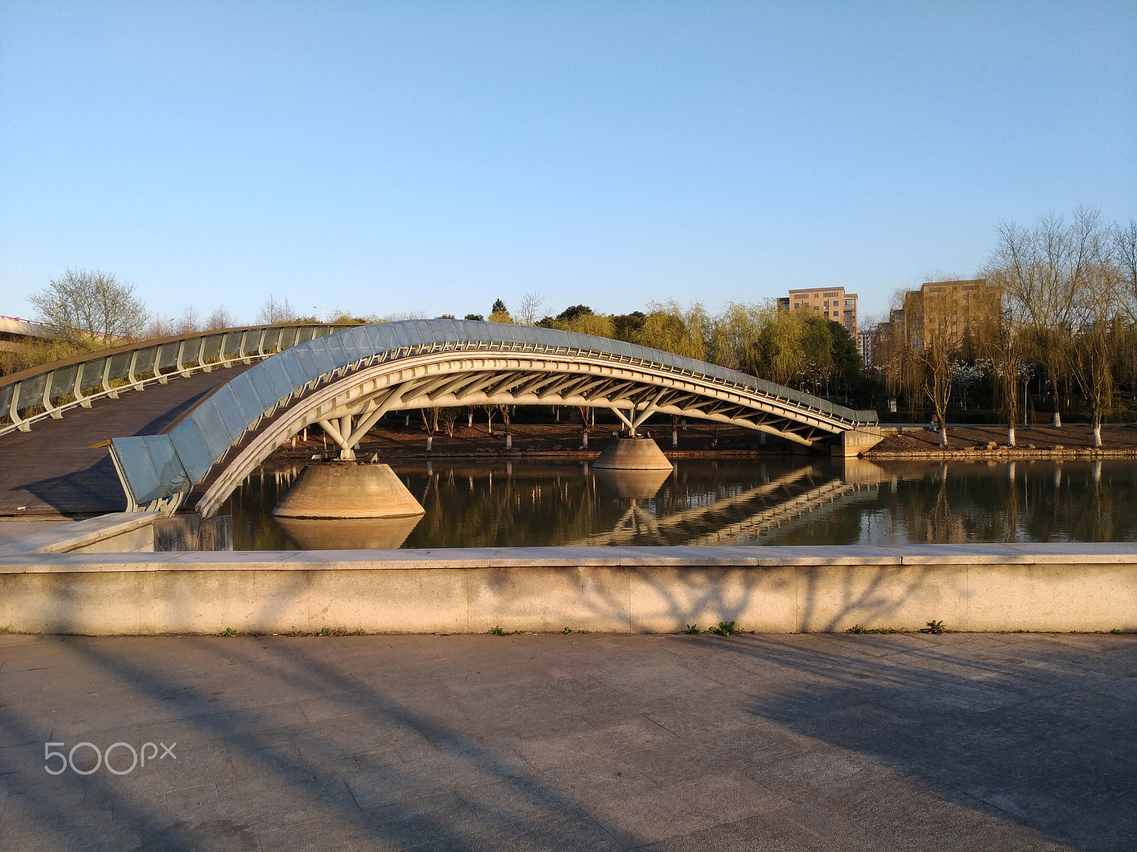 ASUS ZenFone 3 (ZE552KL) sample photo. A bridge across a lake in a park photography