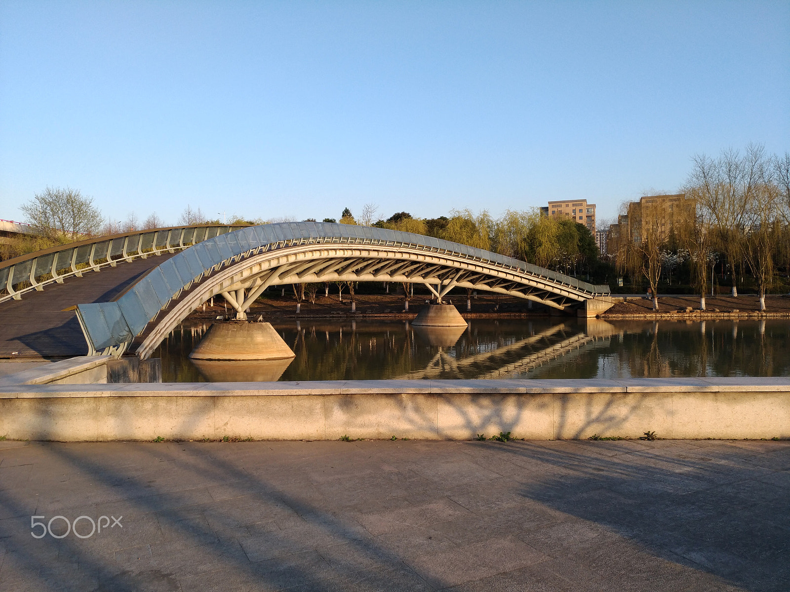 ASUS ZenFone 3 (ZE552KL) sample photo. A bridge across a lake in a park photography