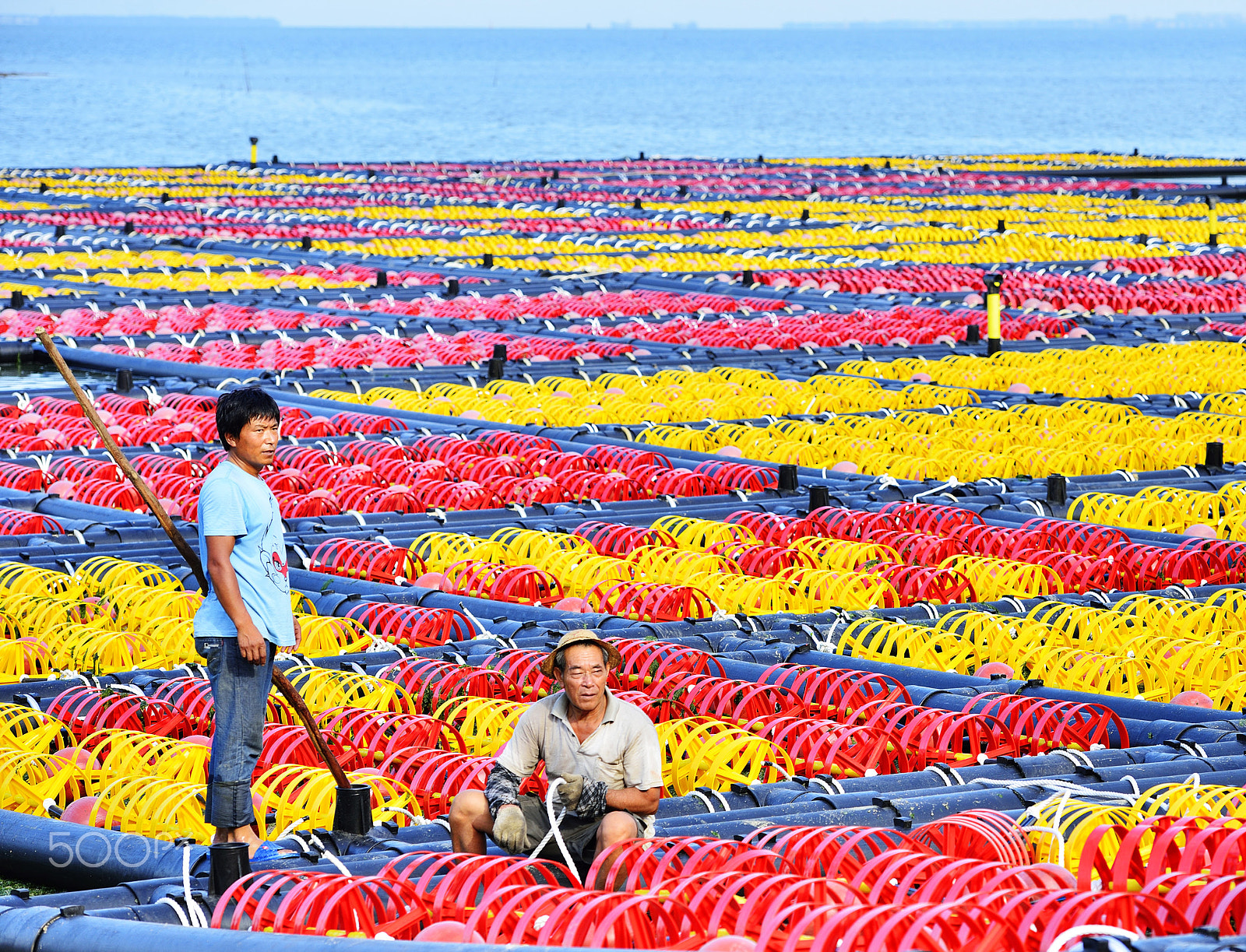 Nikon AF-S Nikkor 70-200mm F2.8G ED VR II sample photo. Fishermen working by the sea photography
