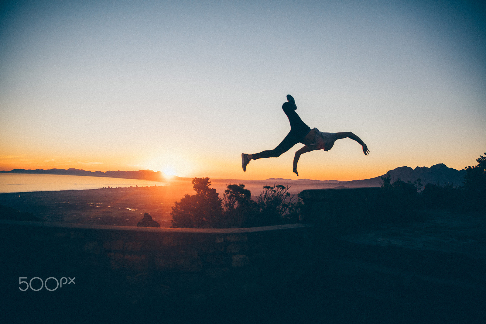 Canon EOS 5DS sample photo. Young adult men jumping high in sunset photography