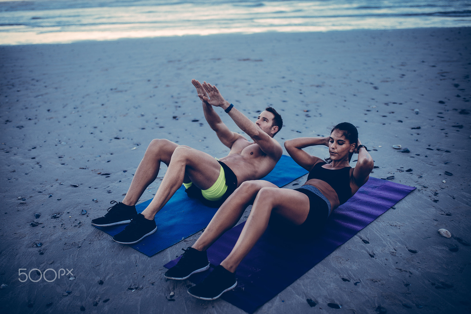 Canon EOS 5DS sample photo. Young adult couple doing fitness workout on beach photography