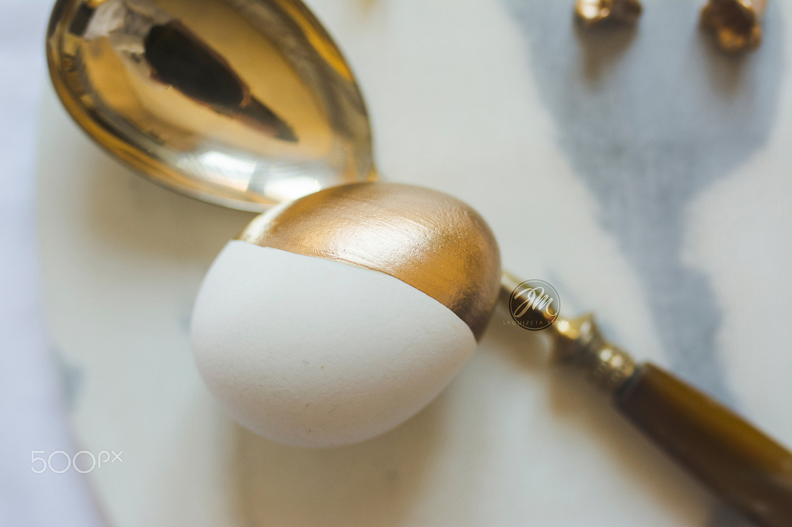Nikon D7100 + Sigma 35mm F1.4 DG HSM Art sample photo. Easter: place setting, elegant gold and white egg, on marble pla photography
