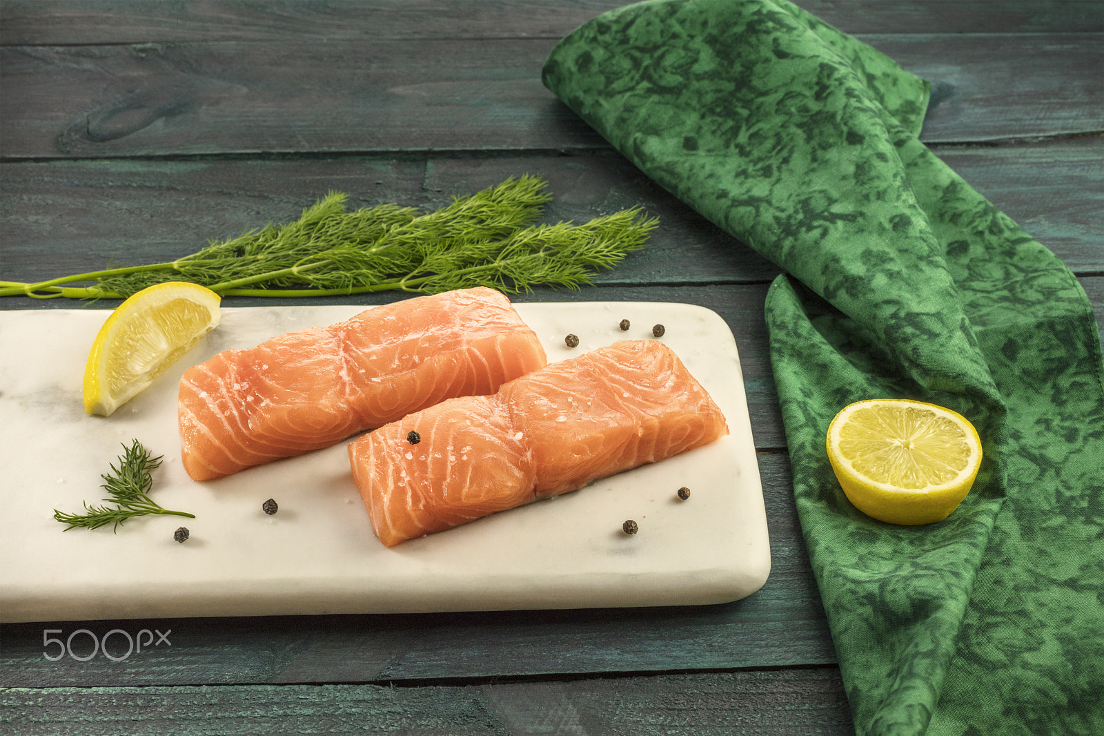 Canon EOS 5DS R sample photo. Two slices of salmon on dark background with copyspace photography