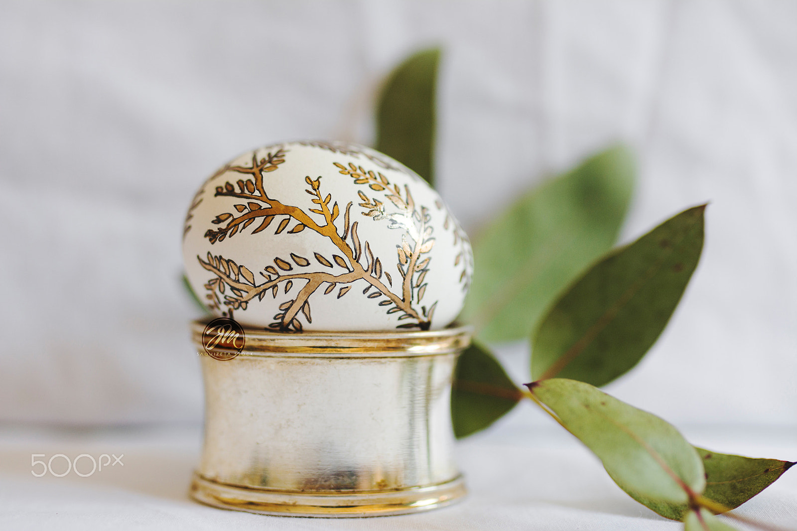 Nikon D7100 sample photo. Easter egg, painted with golden branches on silver container. photography