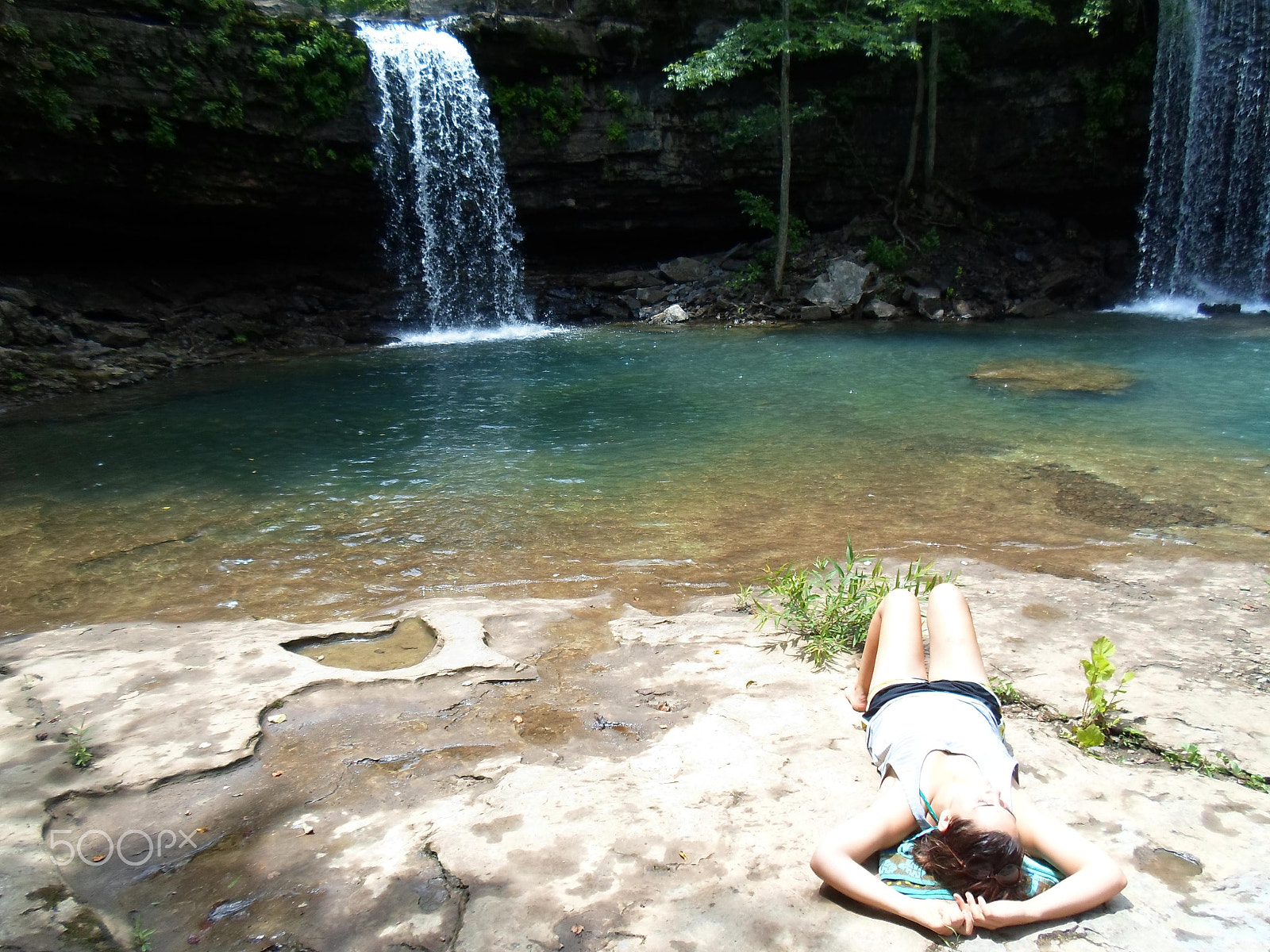 Samsung ST66 / ST68 sample photo. Girl lounging on rock ledge by waterfall photography