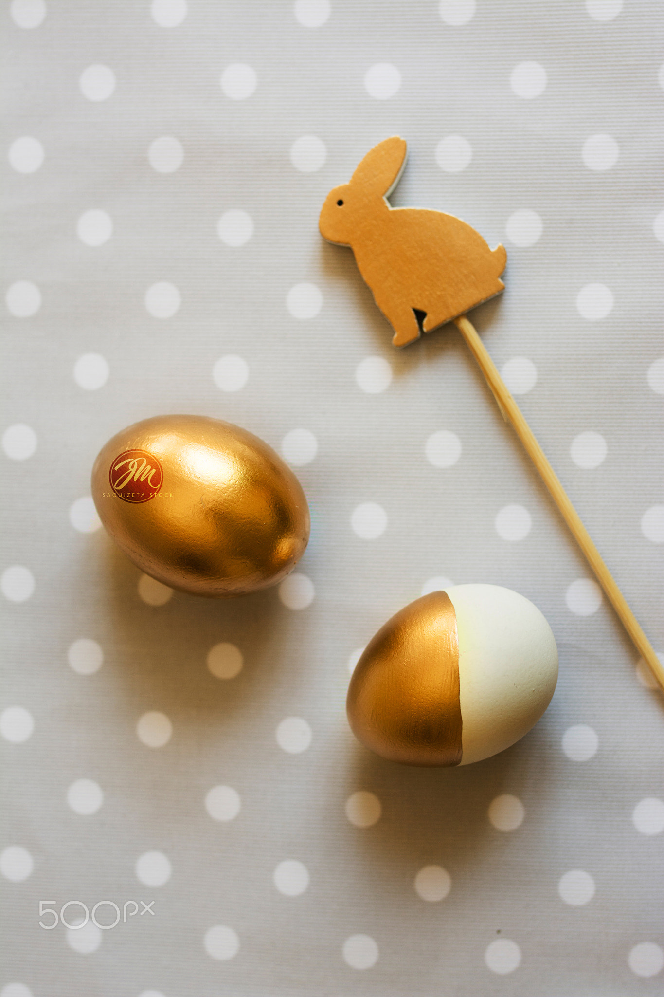 Gold easter eggs and wood rabbit decorated, from above