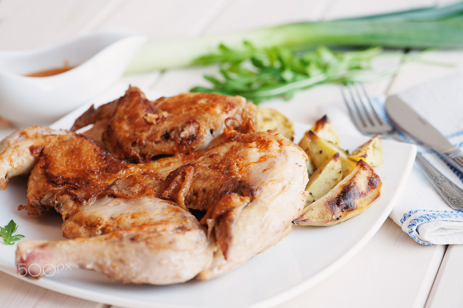 Nikon D700 sample photo. Roasted whole chicken on dish with cutlery photography