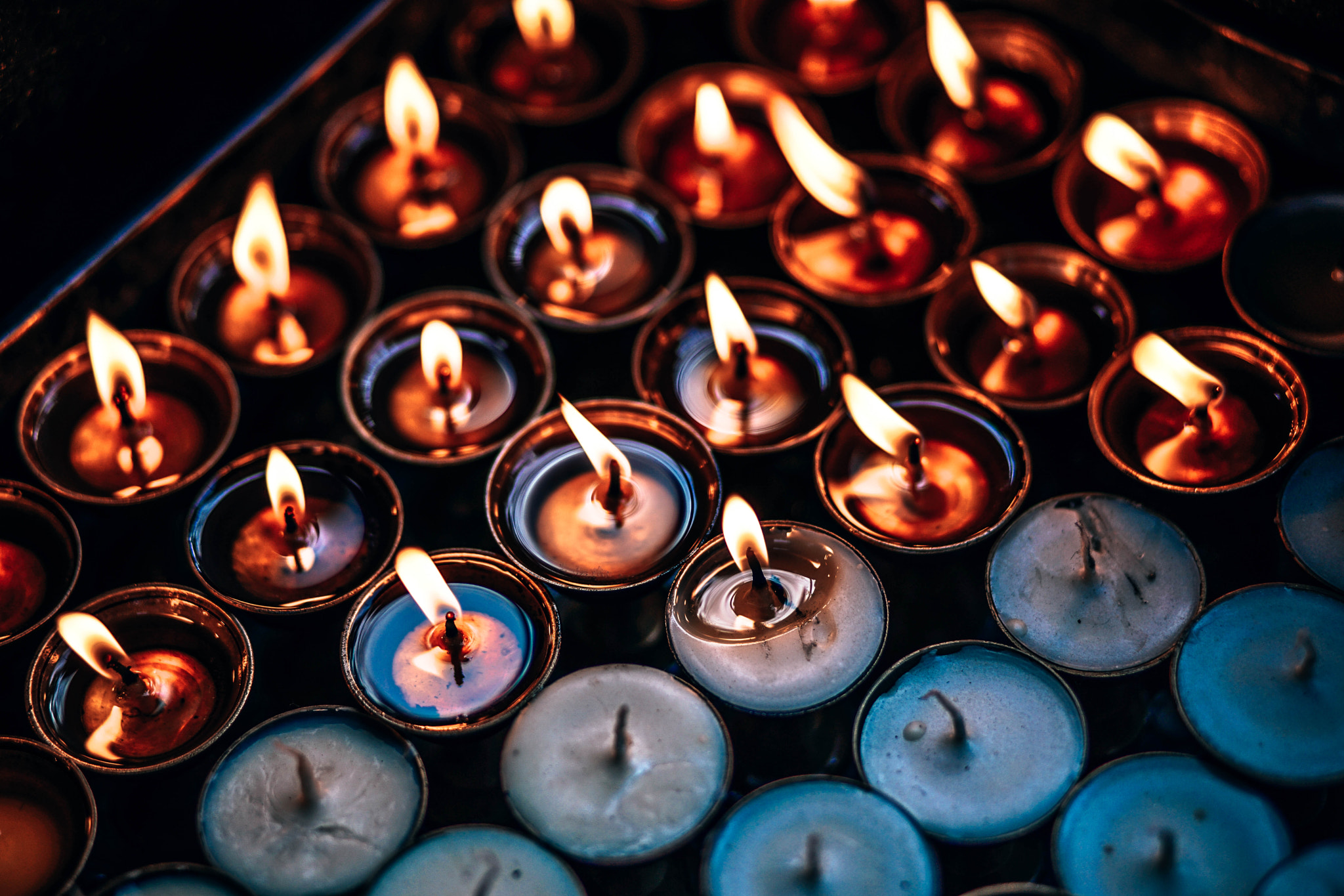 Sony a7 II sample photo. Burning prayer candles photography