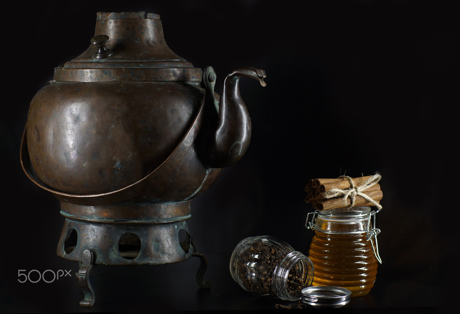 Sony SLT-A65 (SLT-A65V) sample photo. An ancient copper kettle on legs, a jar of honey and cinnamon sticks photography