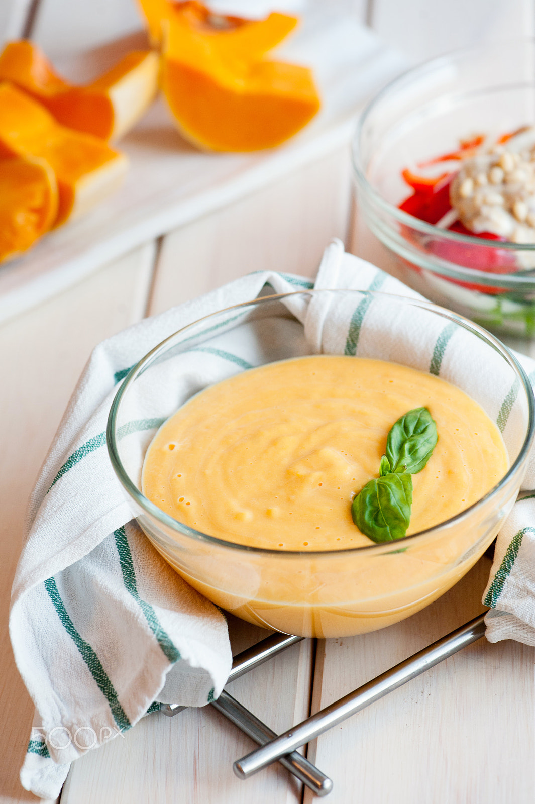 Nikon AF-S Micro-Nikkor 105mm F2.8G IF-ED VR sample photo. Pumpkin cream soup with basil and pumpkin slice on wooden background photography