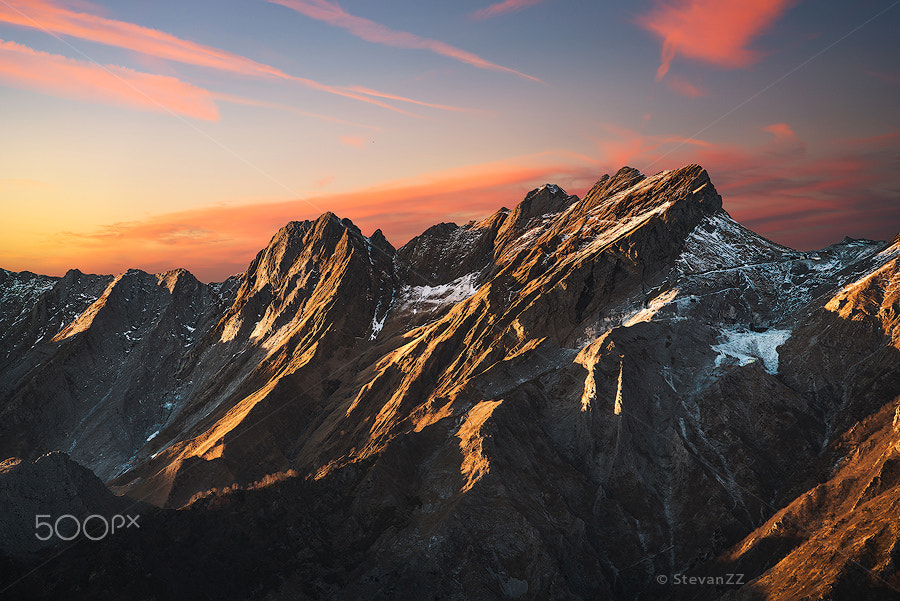 Sony a7R II + Sony Sonnar T* FE 35mm F2.8 ZA sample photo. Apuane alpi snowy mountains and marble quarry at sunset in winte photography