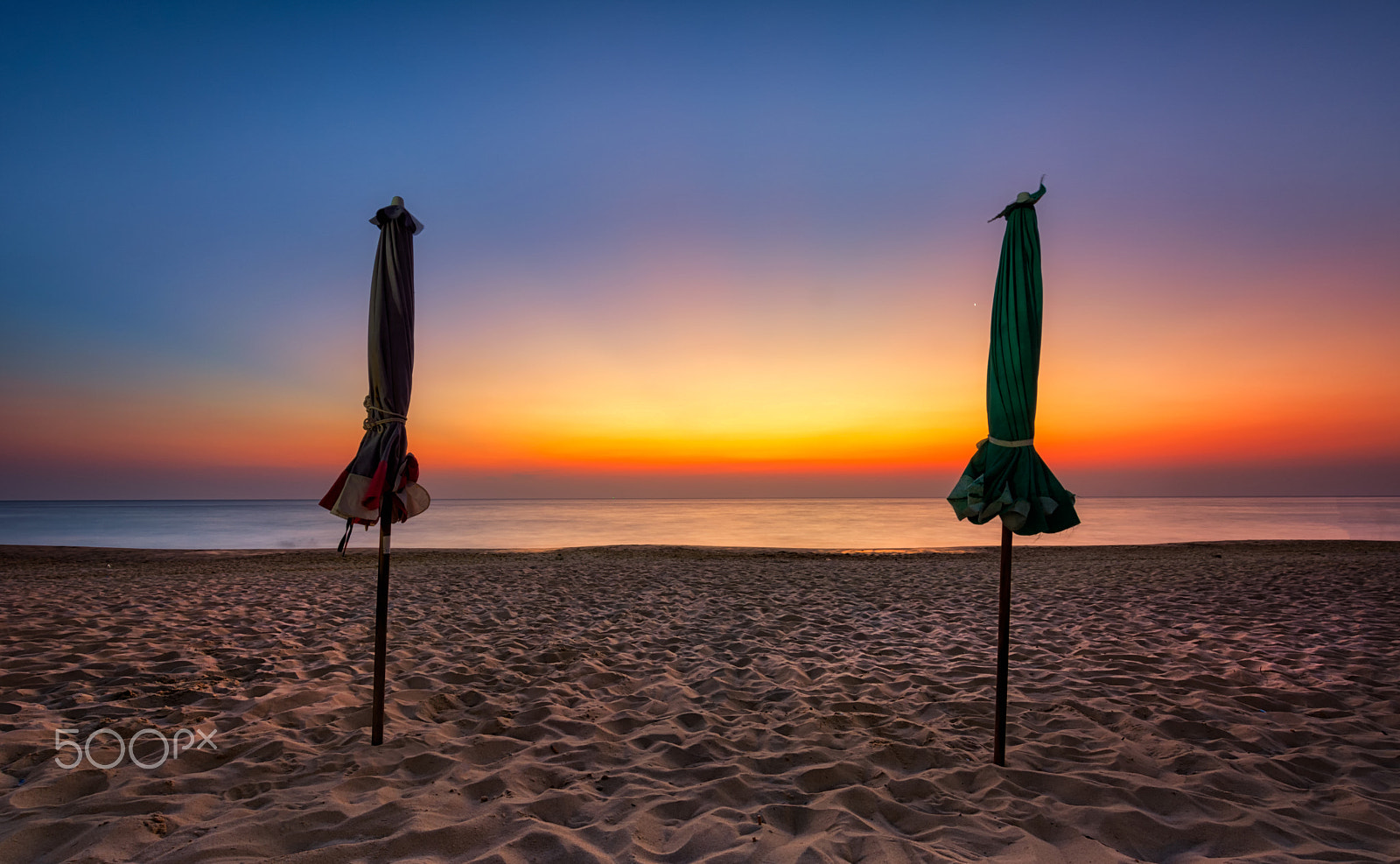 Nikon D5200 sample photo. Beach umbrella at karon beach with sunset background. photography