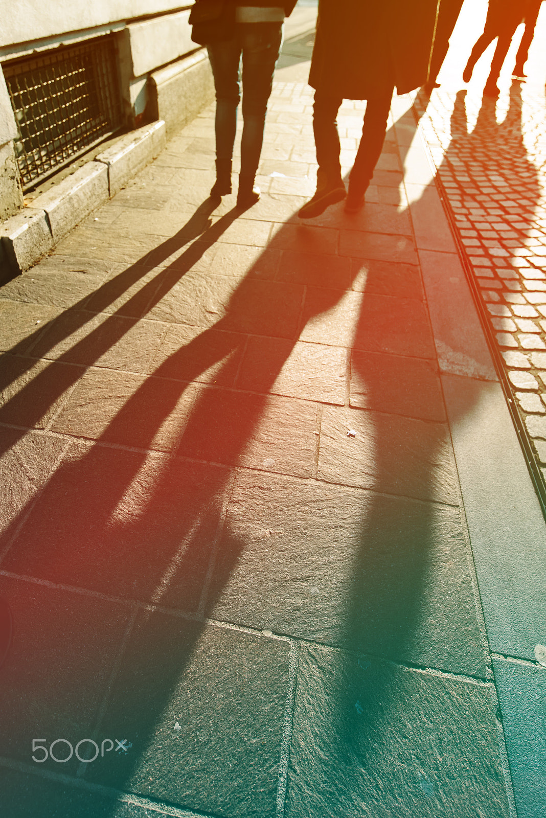 Tamron SP 15-30mm F2.8 Di VC USD sample photo. Long shadows of pedestrian people on the street photography