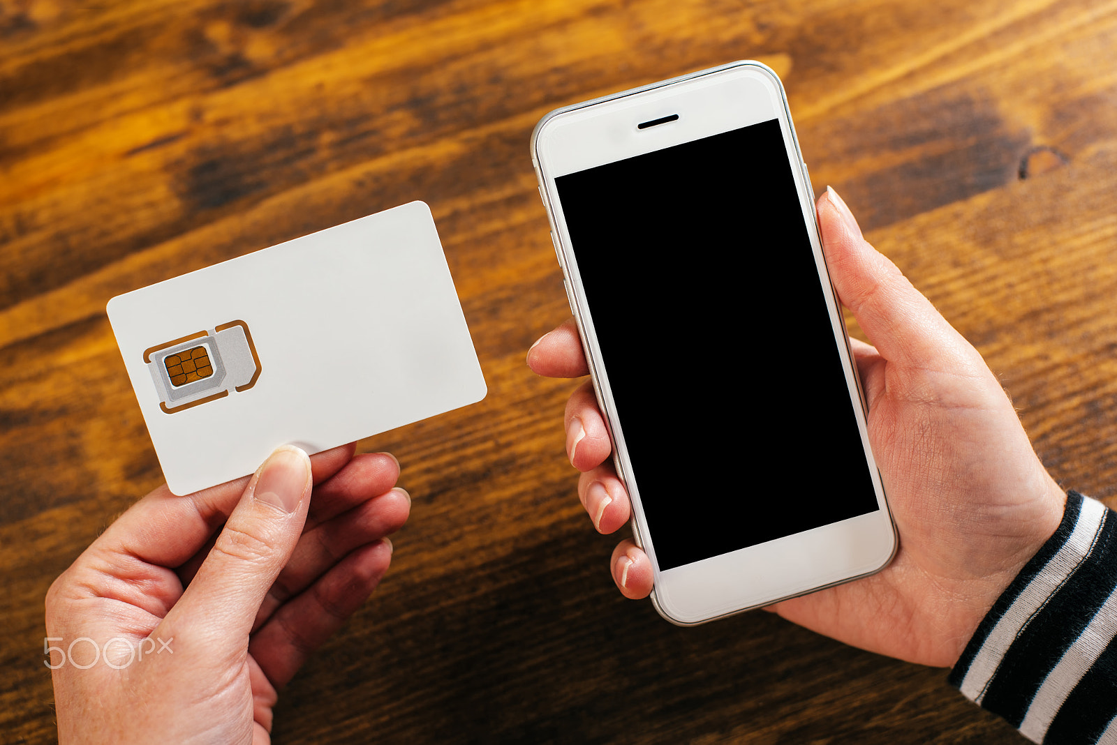 Nikon D810 + Nikon AF-S Nikkor 50mm F1.8G sample photo. Woman holding smartphone and new sim card photography