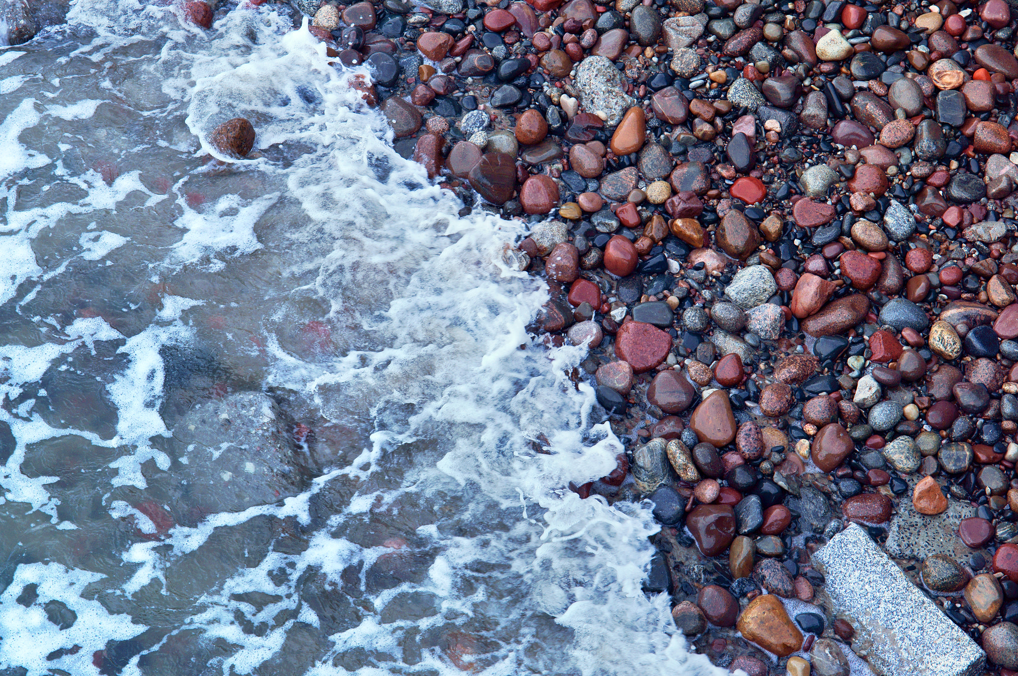 Sony Alpha NEX-3N + E 50mm F1.8 OSS sample photo. Sea stones summer photography