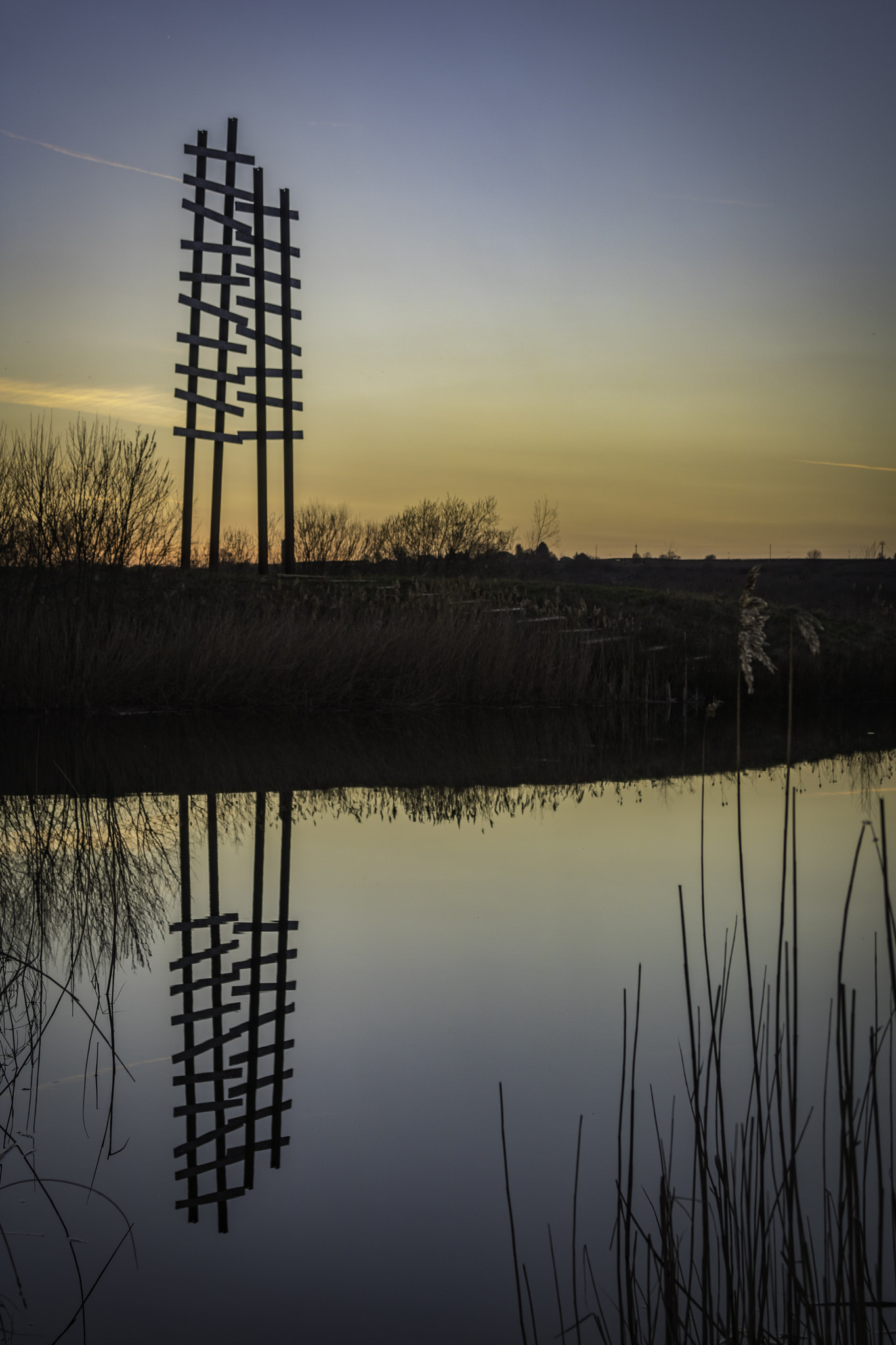 Canon EOS 750D (EOS Rebel T6i / EOS Kiss X8i) + Canon EF 24-105mm F4L IS USM sample photo. Sunset reflection of the heritage railway sculpture at stanwick lakes, northamptonshire photography