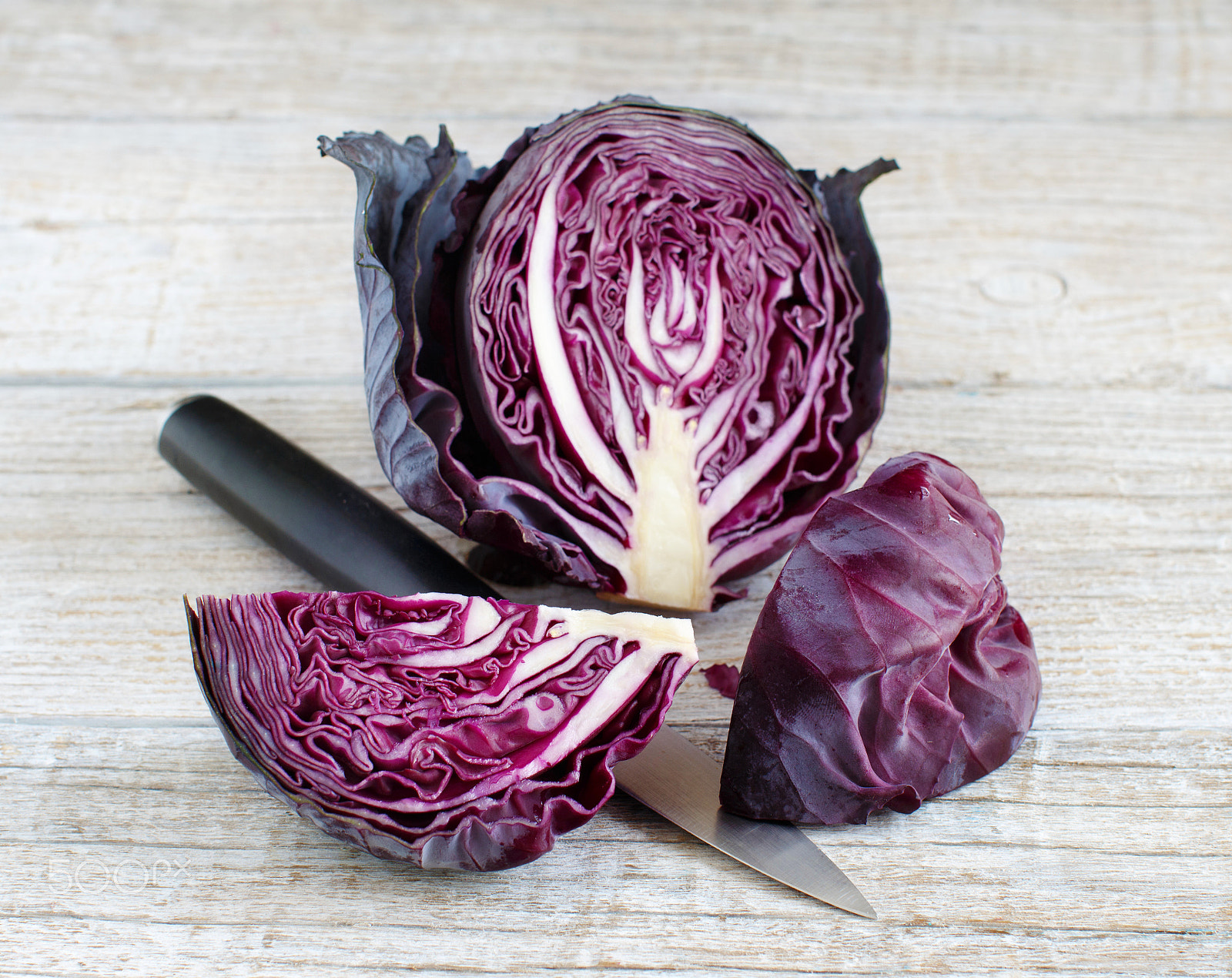 Canon EOS 650D (EOS Rebel T4i / EOS Kiss X6i) + Canon EF 50mm F1.2L USM sample photo. Red cabbage with a knife photography