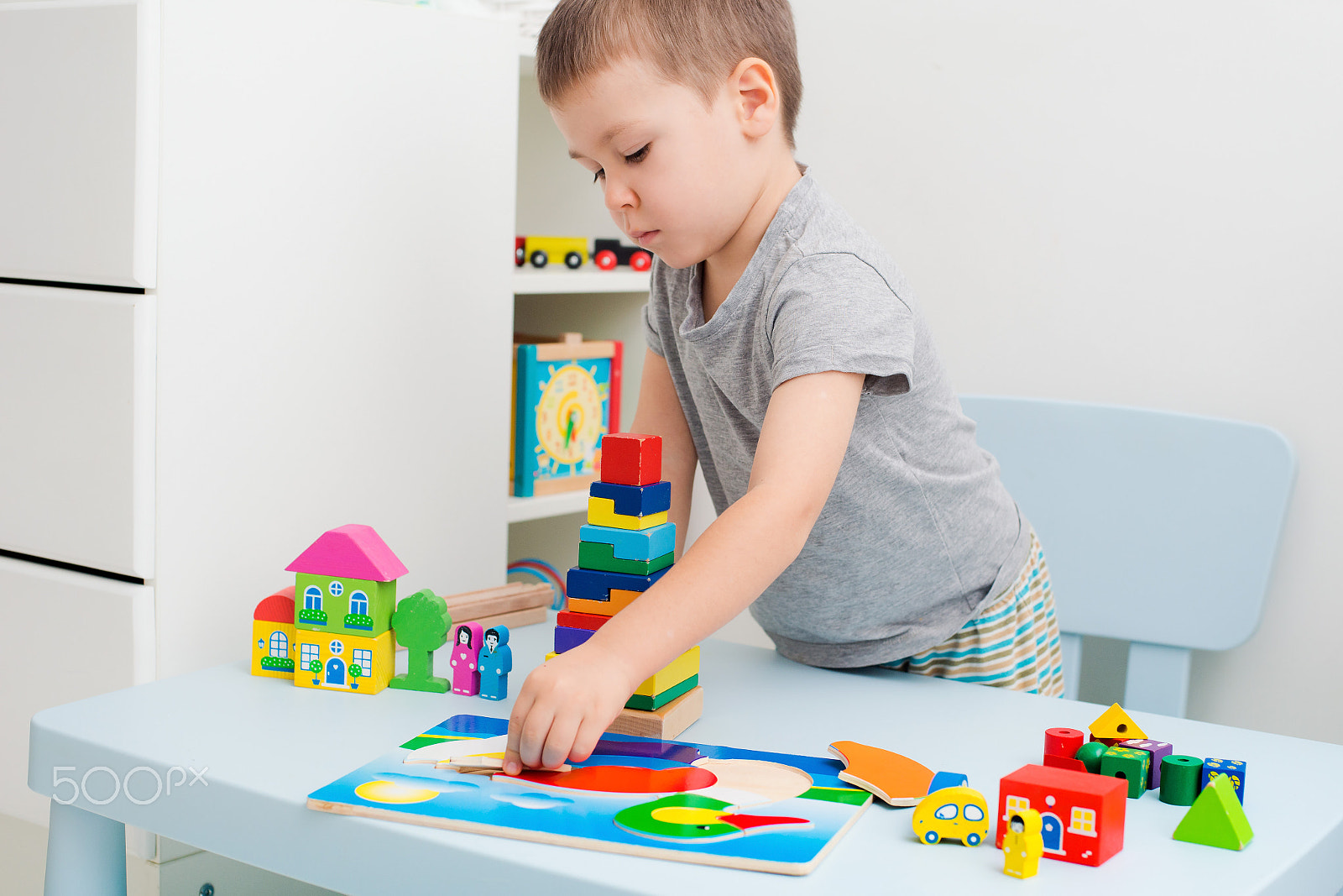 Nikon D800 + Nikon AF Nikkor 50mm F1.4D sample photo. Child hands collect wooden puzzle photography