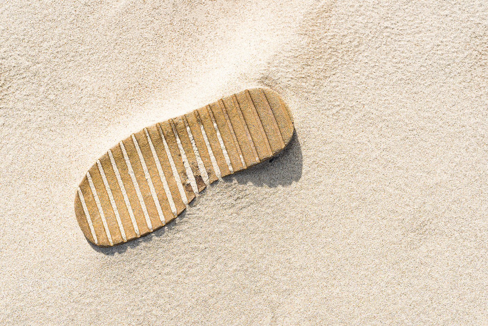 Nikon D800 + Sigma 35mm F1.4 DG HSM Art sample photo. Shoe sole buried in the sand. wavy sand on the beach. abstract. photography