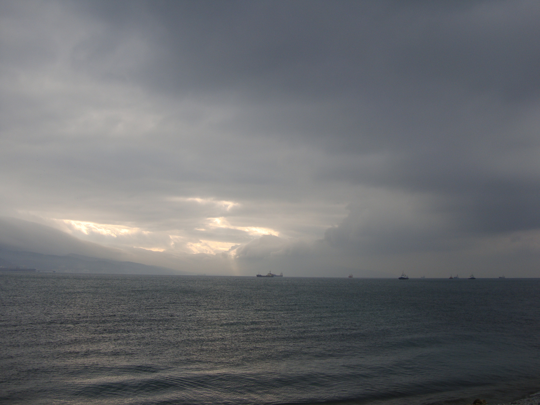 Sony Cyber-shot DSC-W300 sample photo. Dark clouds on sea photography