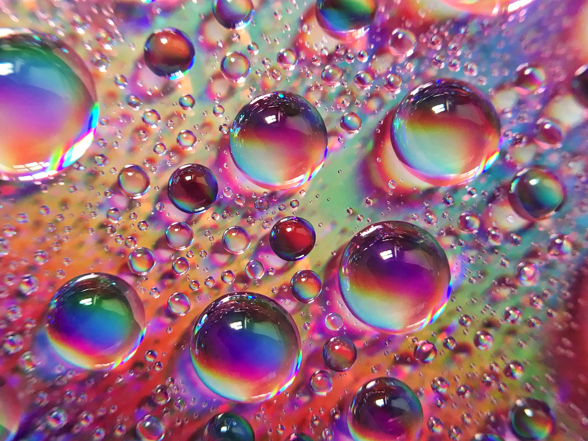 Apple iPhone8,1 sample photo. Water droplets background with amazing colors photography