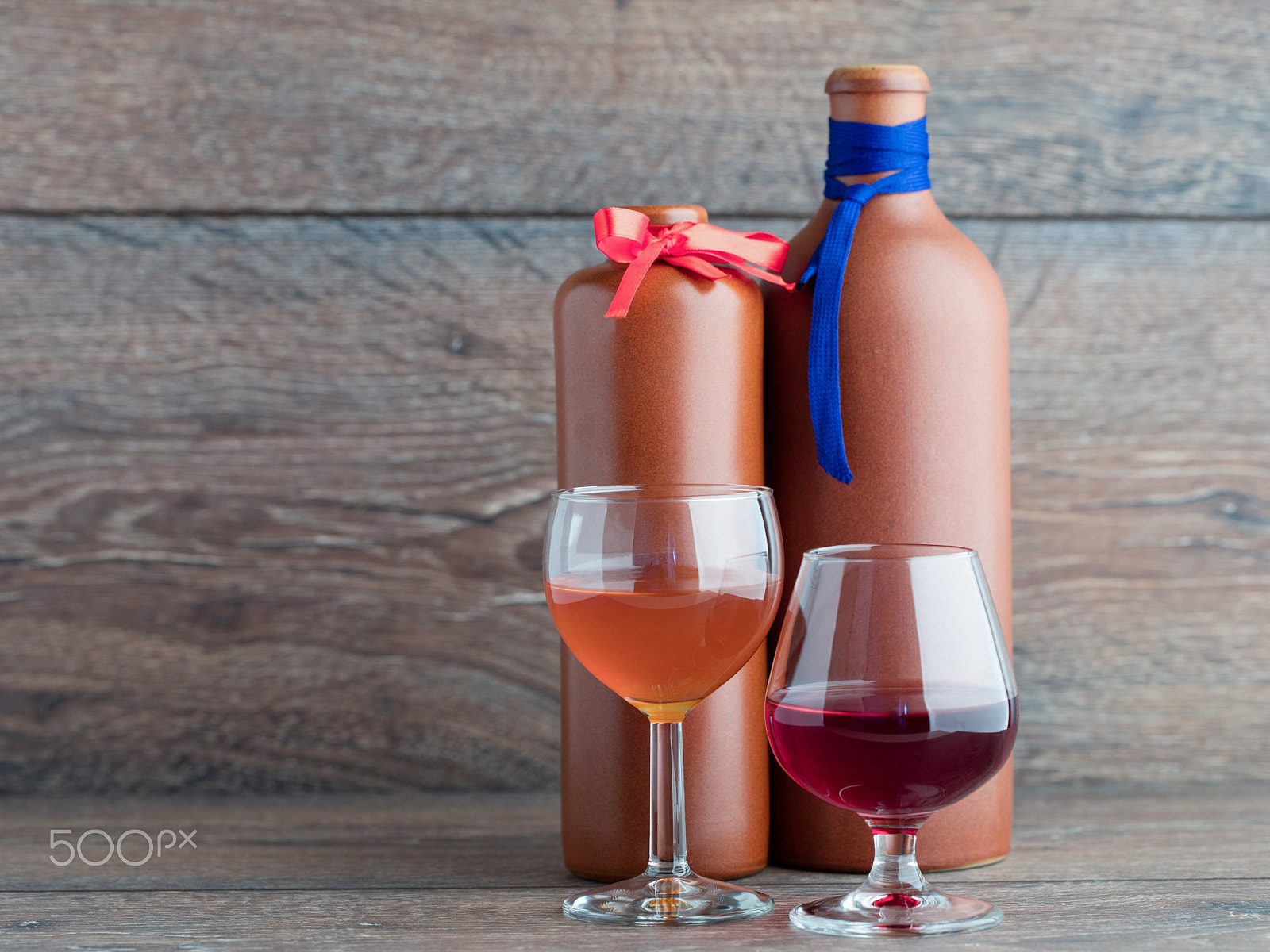 Canon EF 100mm F2.8L Macro IS USM sample photo. Two balsam bottle and two filled glasses on the wooden backgroun photography