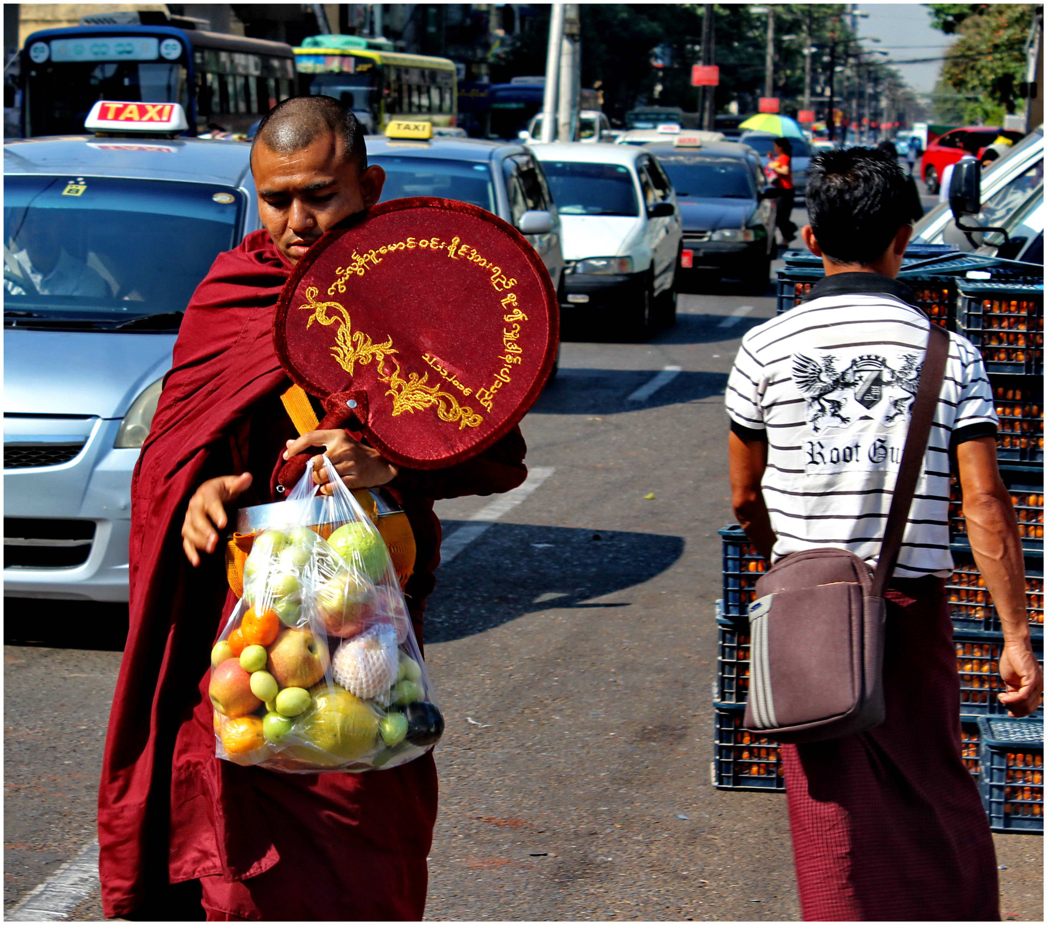 Canon EF-S 18-55mm F3.5-5.6 IS sample photo. Yangon monk and his fruit photography