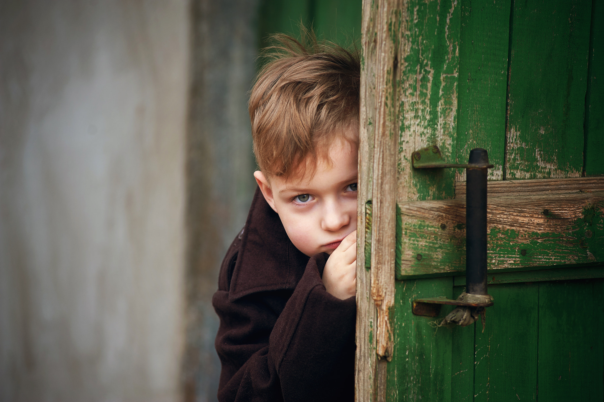 Nikon D700 sample photo. Portrait of sad boy behind the door photography