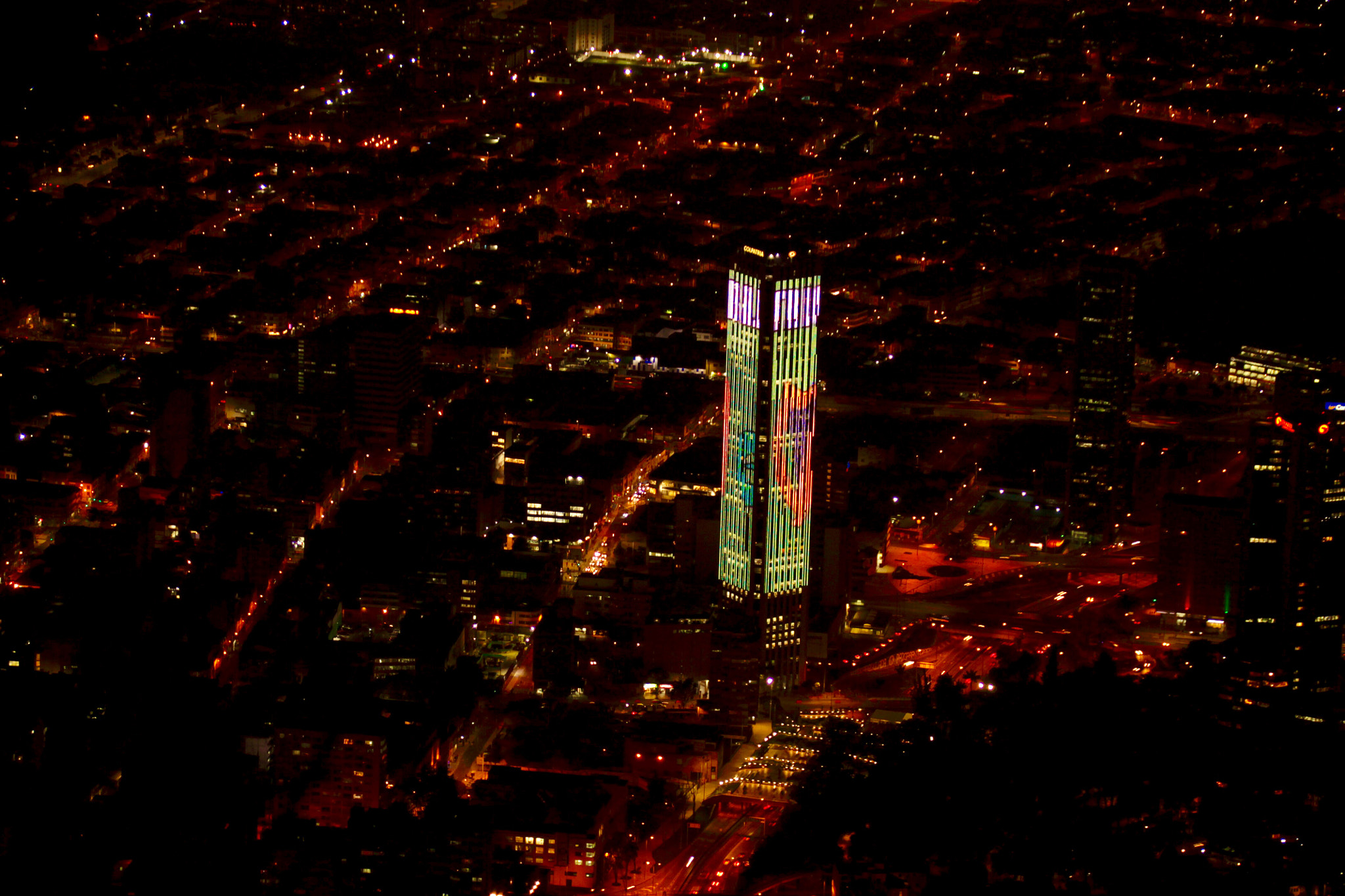 Canon EF 75-300mm F4.0-5.6 IS USM sample photo. Color changing building in bogotá, colombia photography