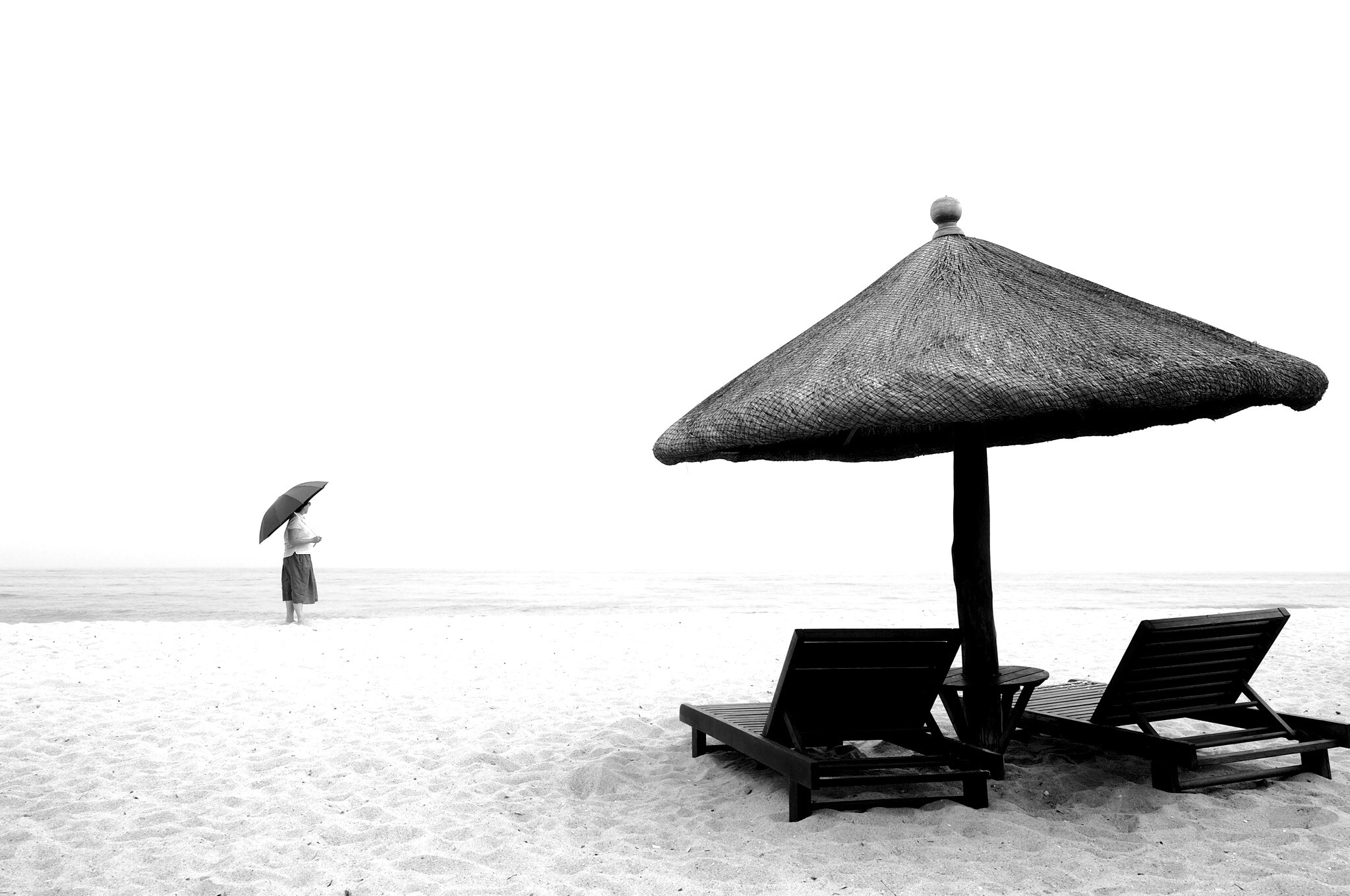 Olympus M.Zuiko Digital ED 12-40mm F2.8 Pro sample photo. Umbrellas by the sea photography