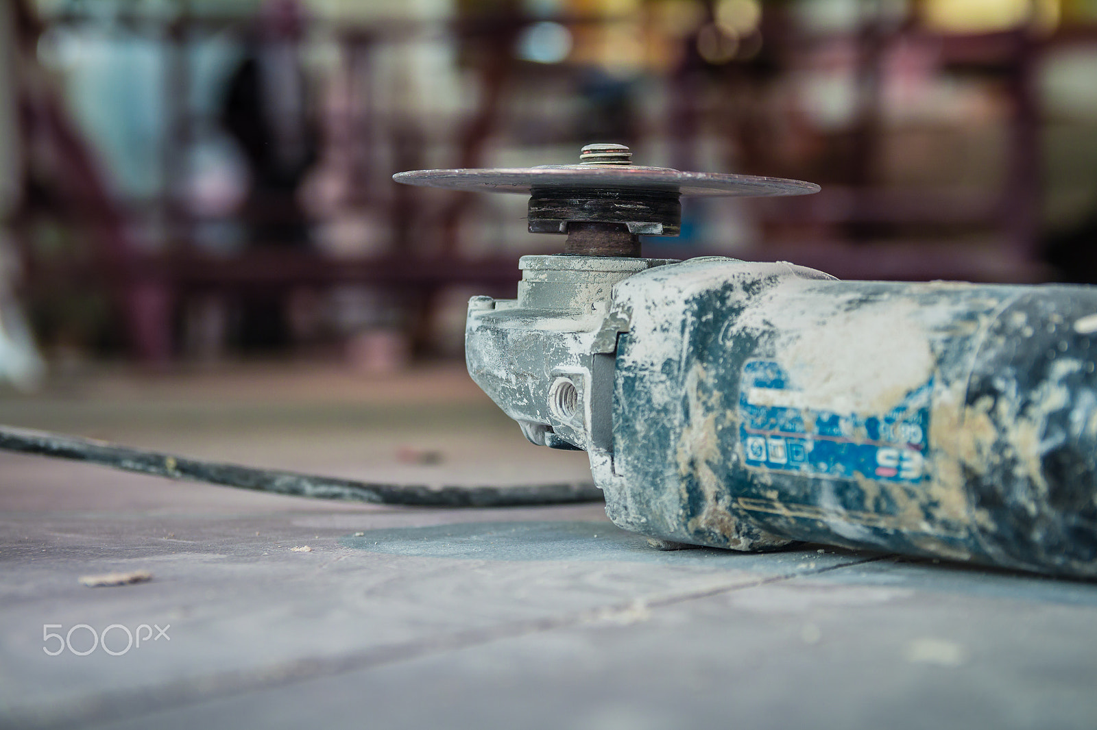 Canon EF-S 17-55mm F2.8 IS USM sample photo. Grinding wheel equipment on the floor in construction site photography