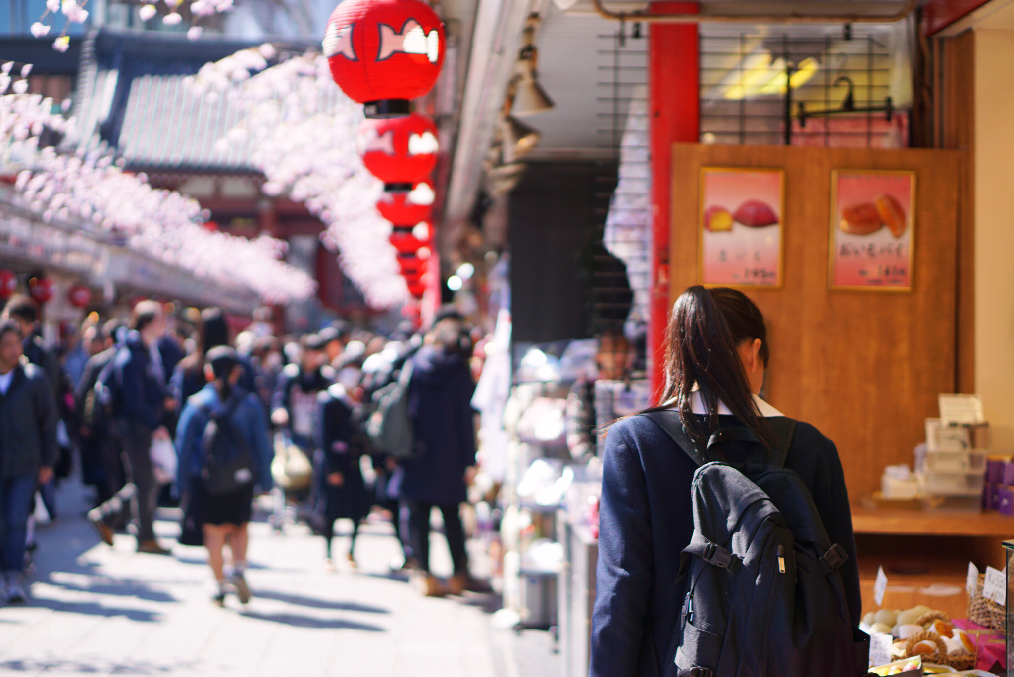 Sony a6000 + Sony E 50mm F1.8 OSS sample photo. Schoolgirl at souvenir shop photography