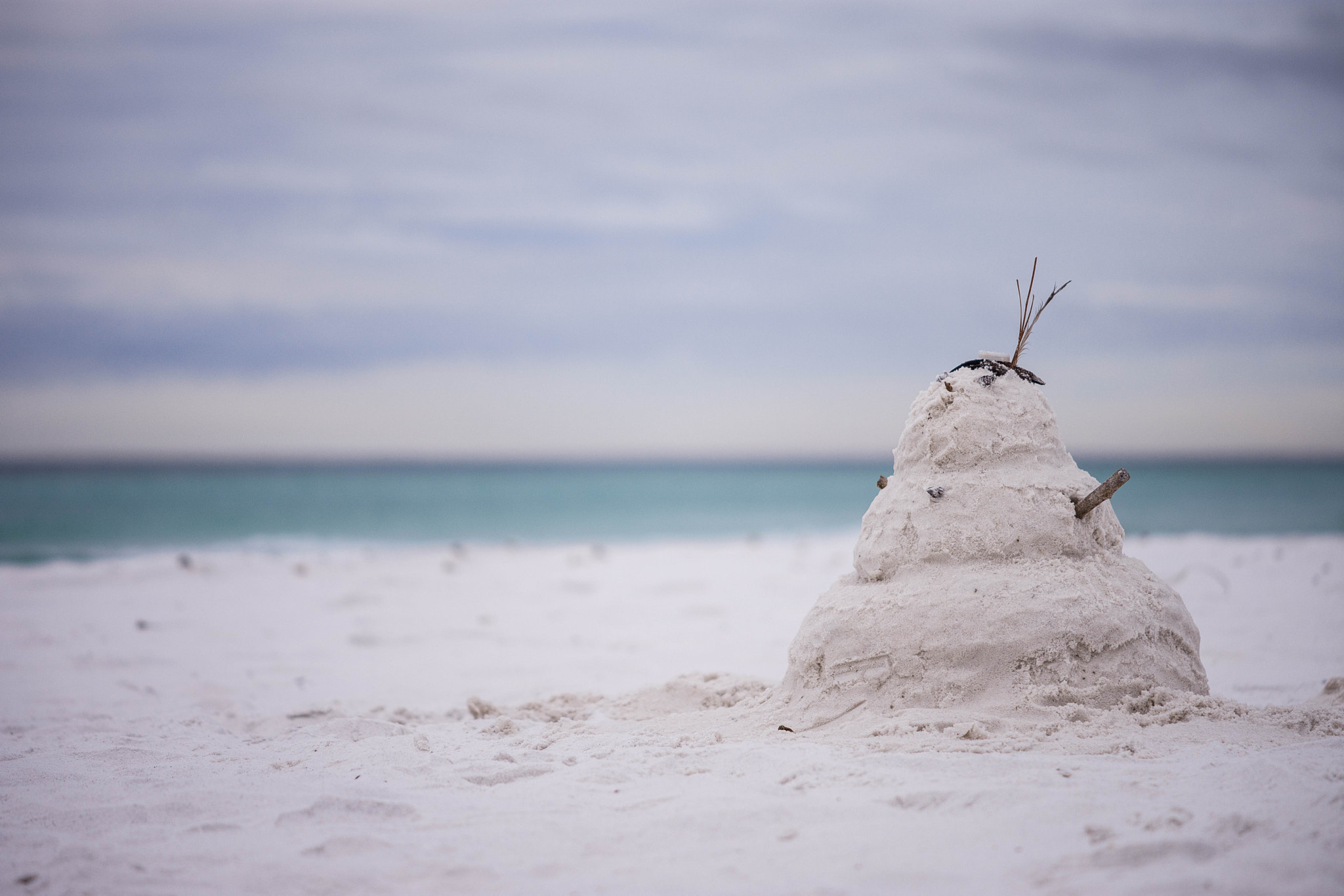 Nikon AF-S DX Micro-Nikkor 85mm F3.5G ED VR sample photo. Beach snowman photography