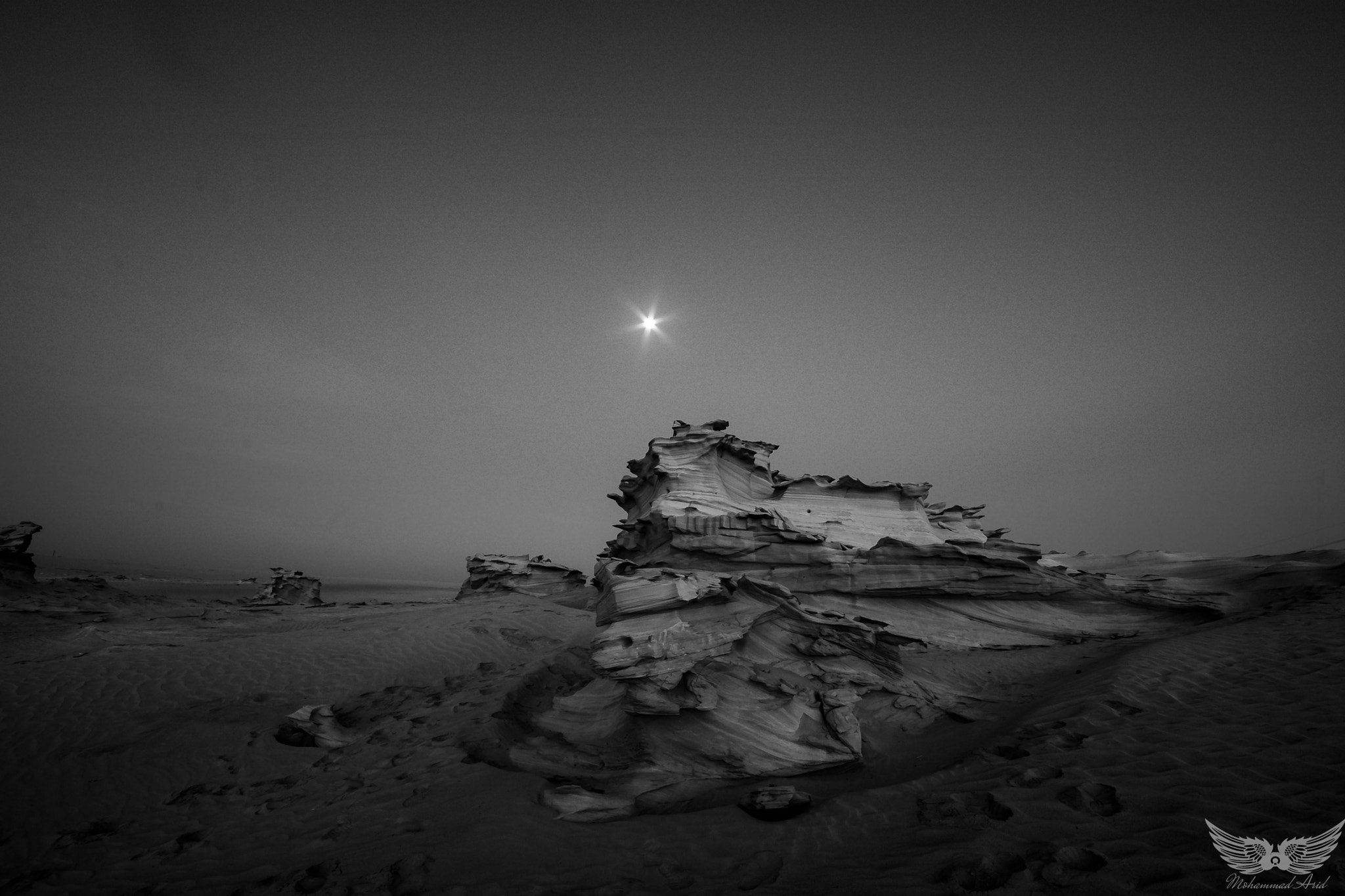 Sigma 10-20mm F4-5.6 EX DC HSM sample photo. Rock b&w with moon photography