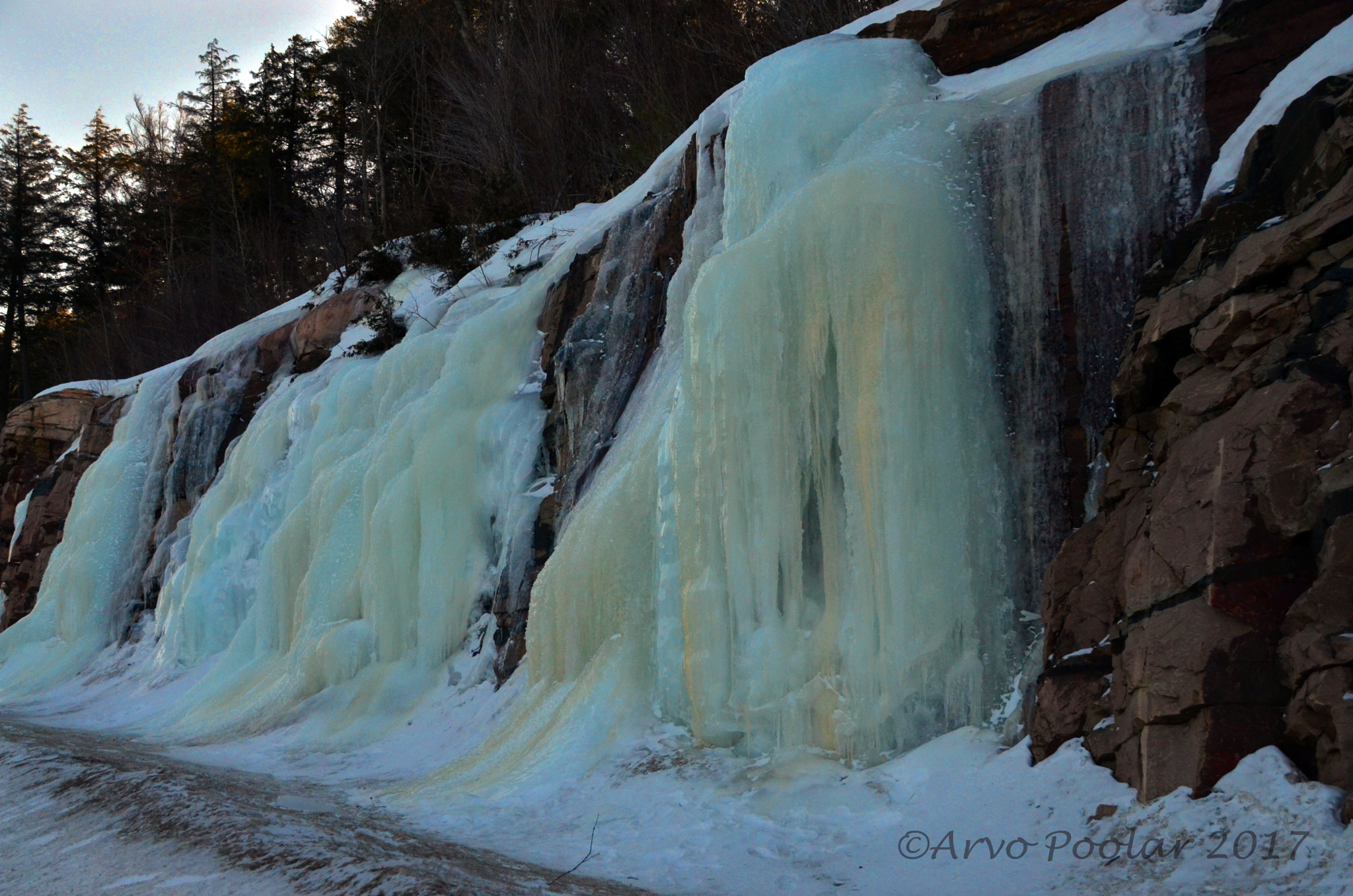 Nikon D7000 sample photo. Ice flows out and over the rocks photography