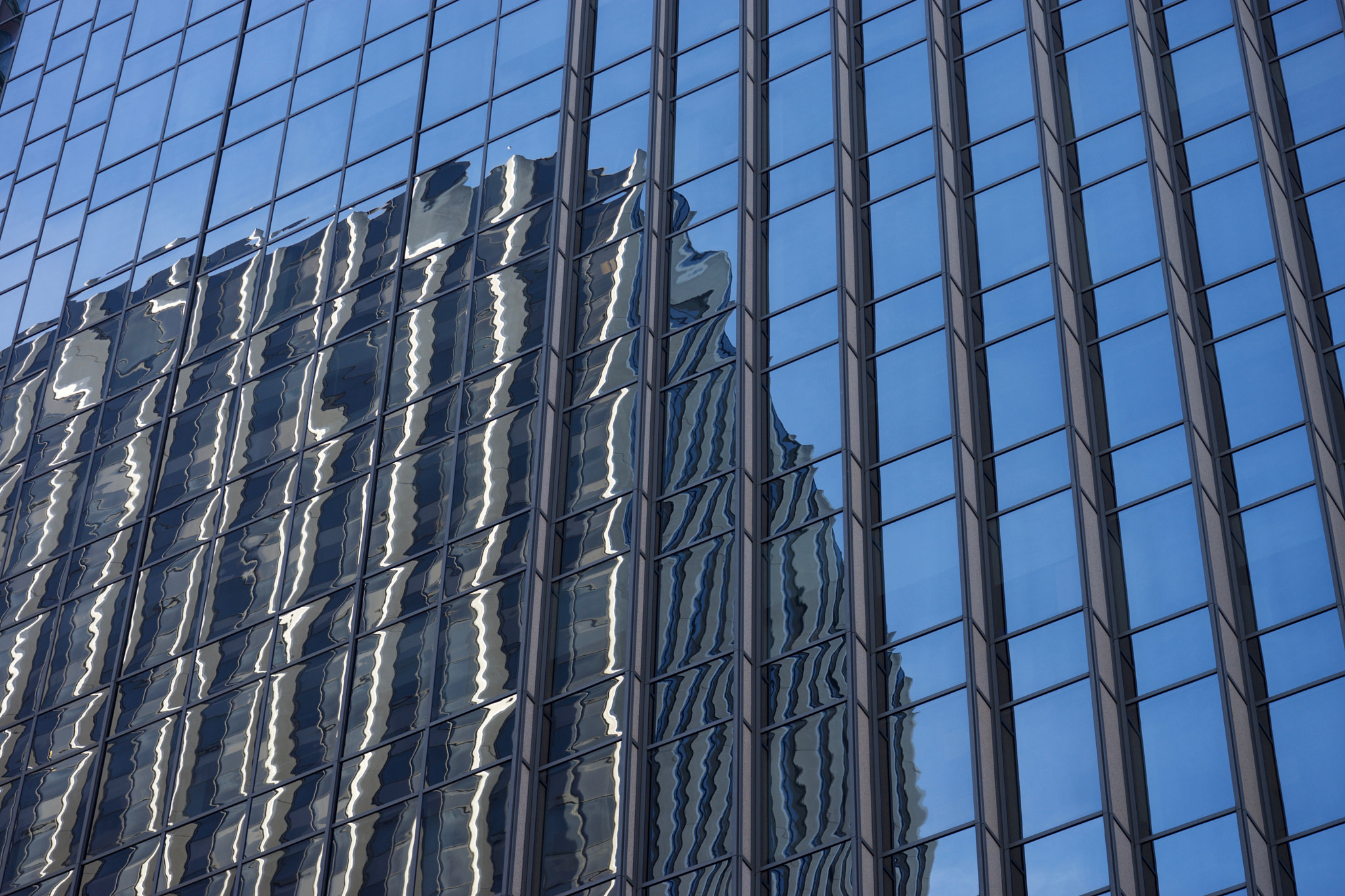 Sony FE 90mm F2.8 Macro G OSS sample photo. Building reflections photography