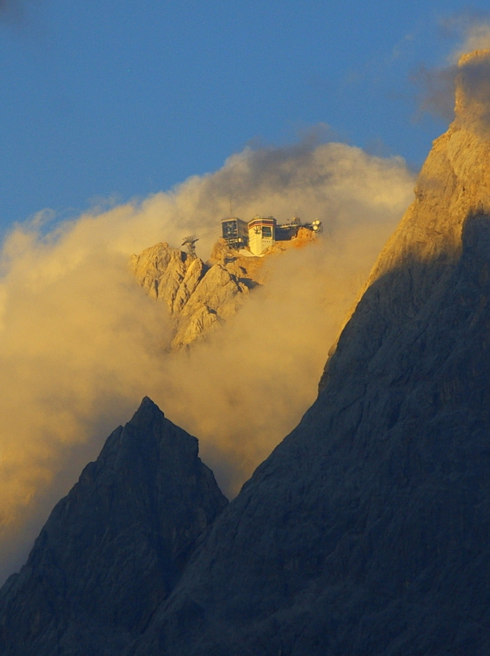 Pentax K100D Super + Pentax smc DA 50-200mm F4-5.6 ED sample photo. At the top, enveloped by clouds - zugspitze photography
