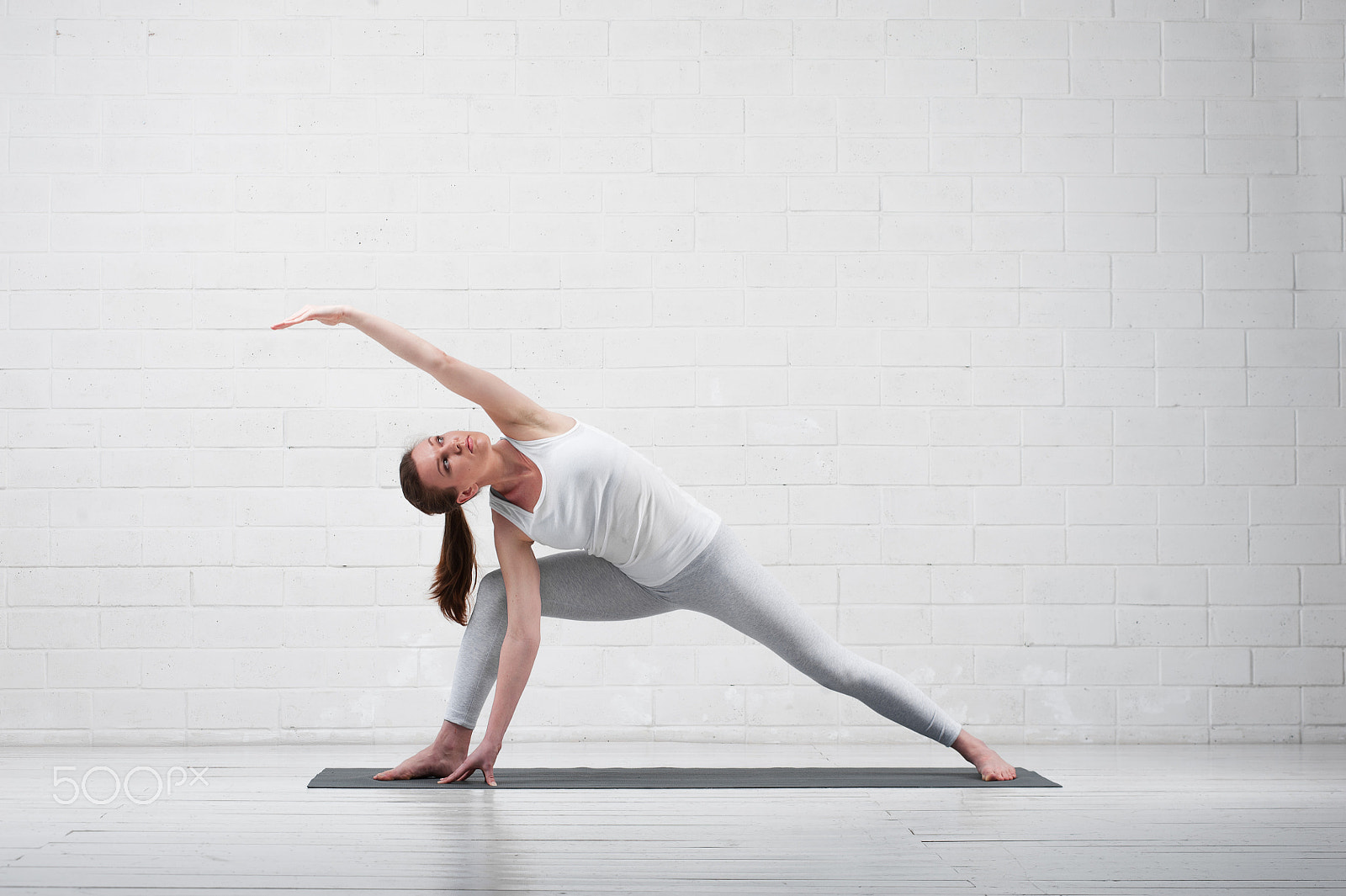 Nikon D700 sample photo. Young flexible woman practicing yoga indoors photography