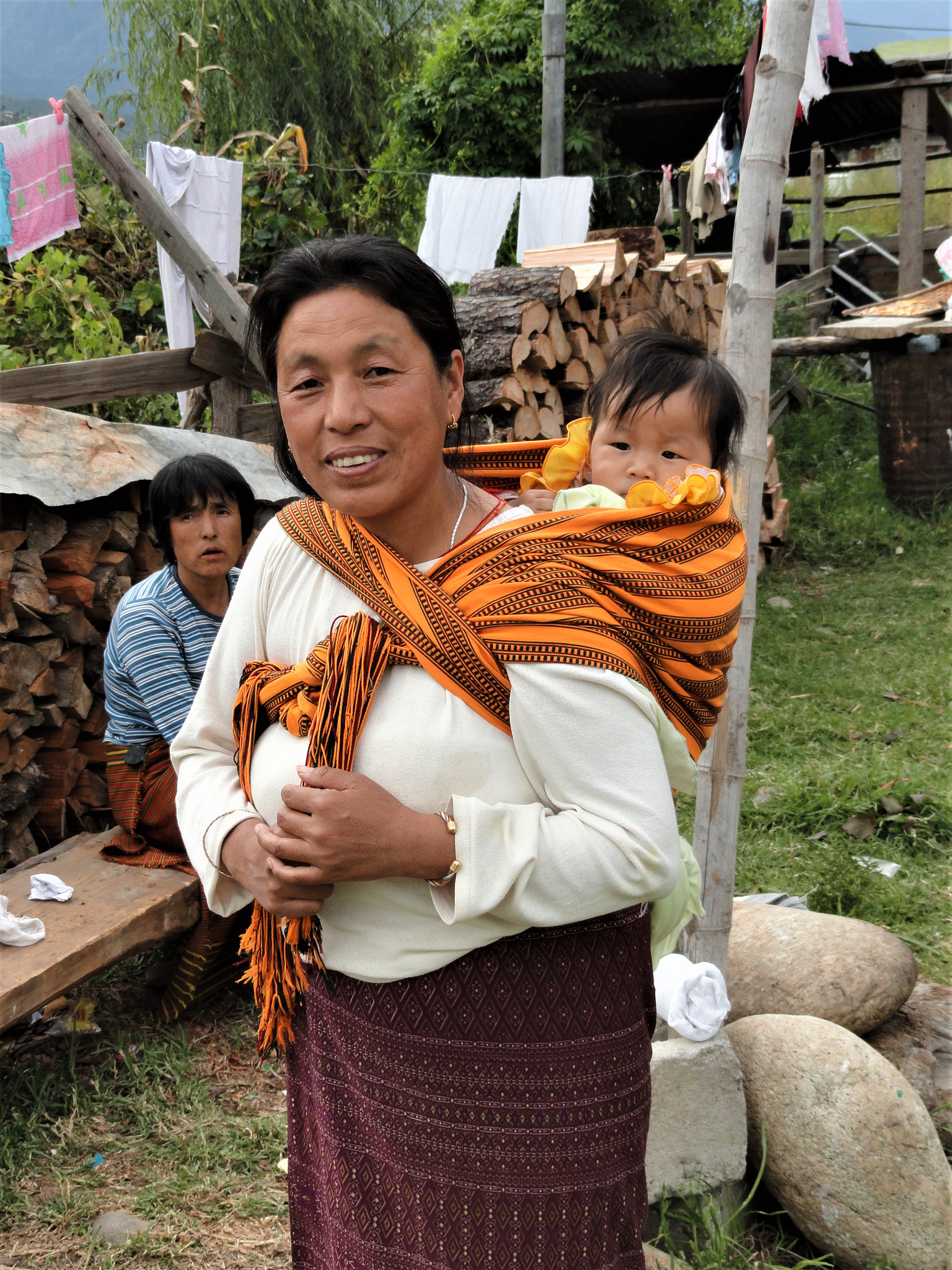 Sony Cyber-shot DSC-H55 sample photo. Bhutanese woman with child photography