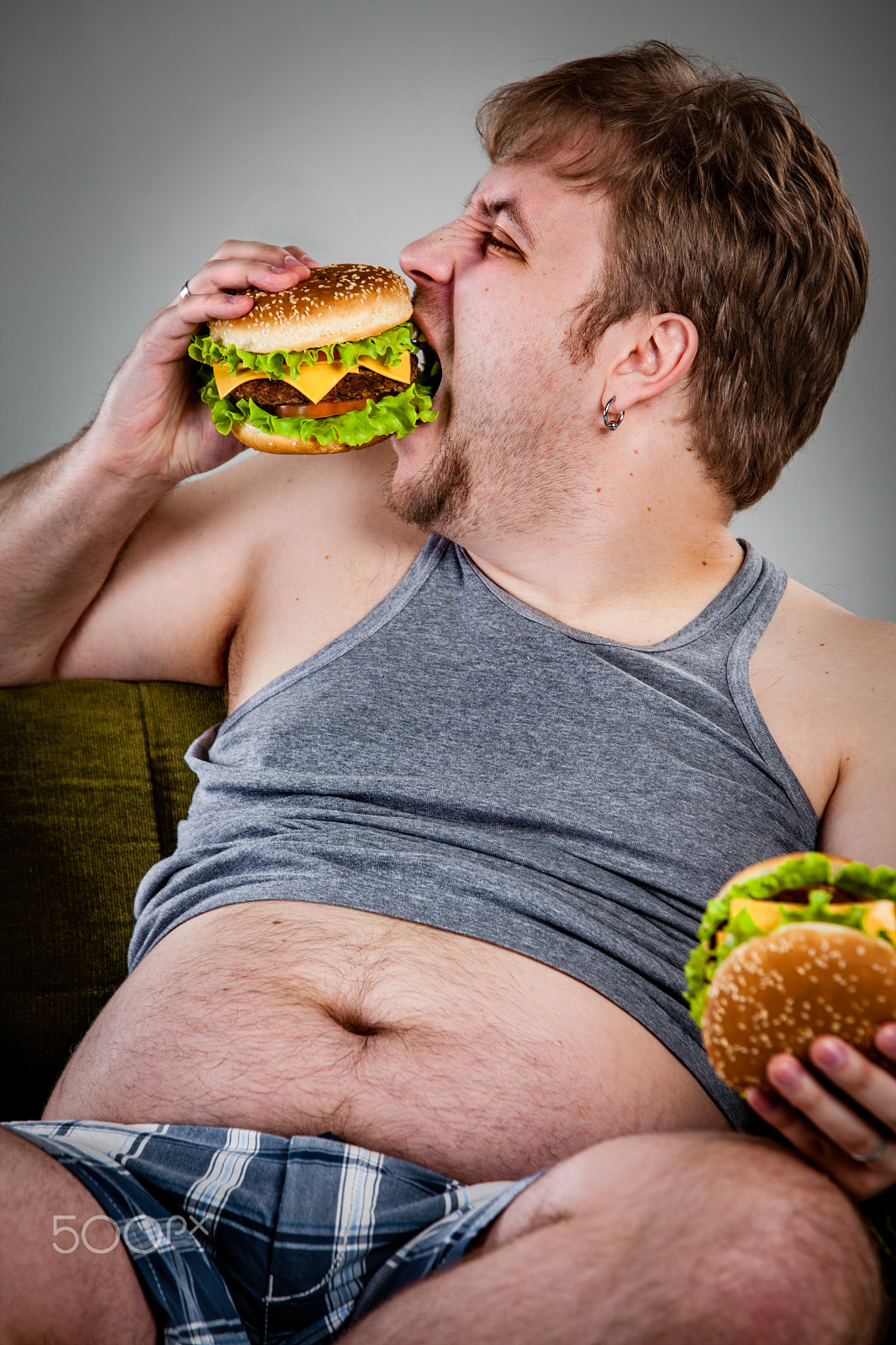 Canon EF 70-200mm F2.8L IS USM sample photo. Fat man eating hamburger photography