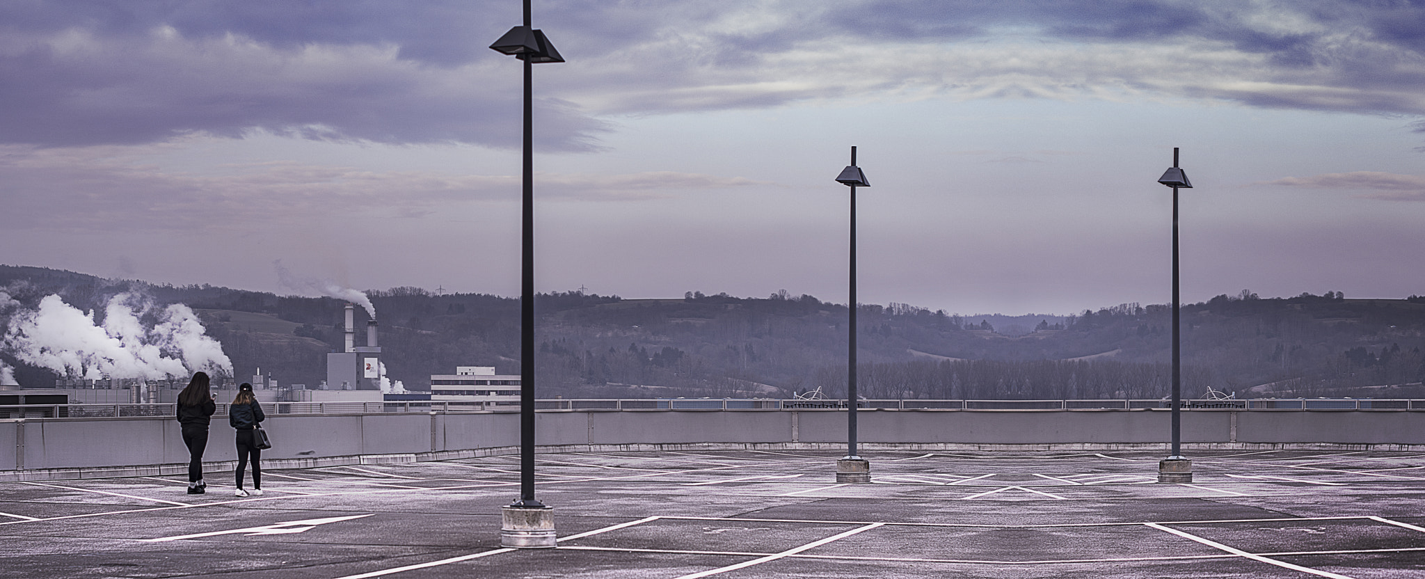 Nikon D7100 + Nikon AF-S Nikkor 50mm F1.4G sample photo. Teens on a parking-deck photography