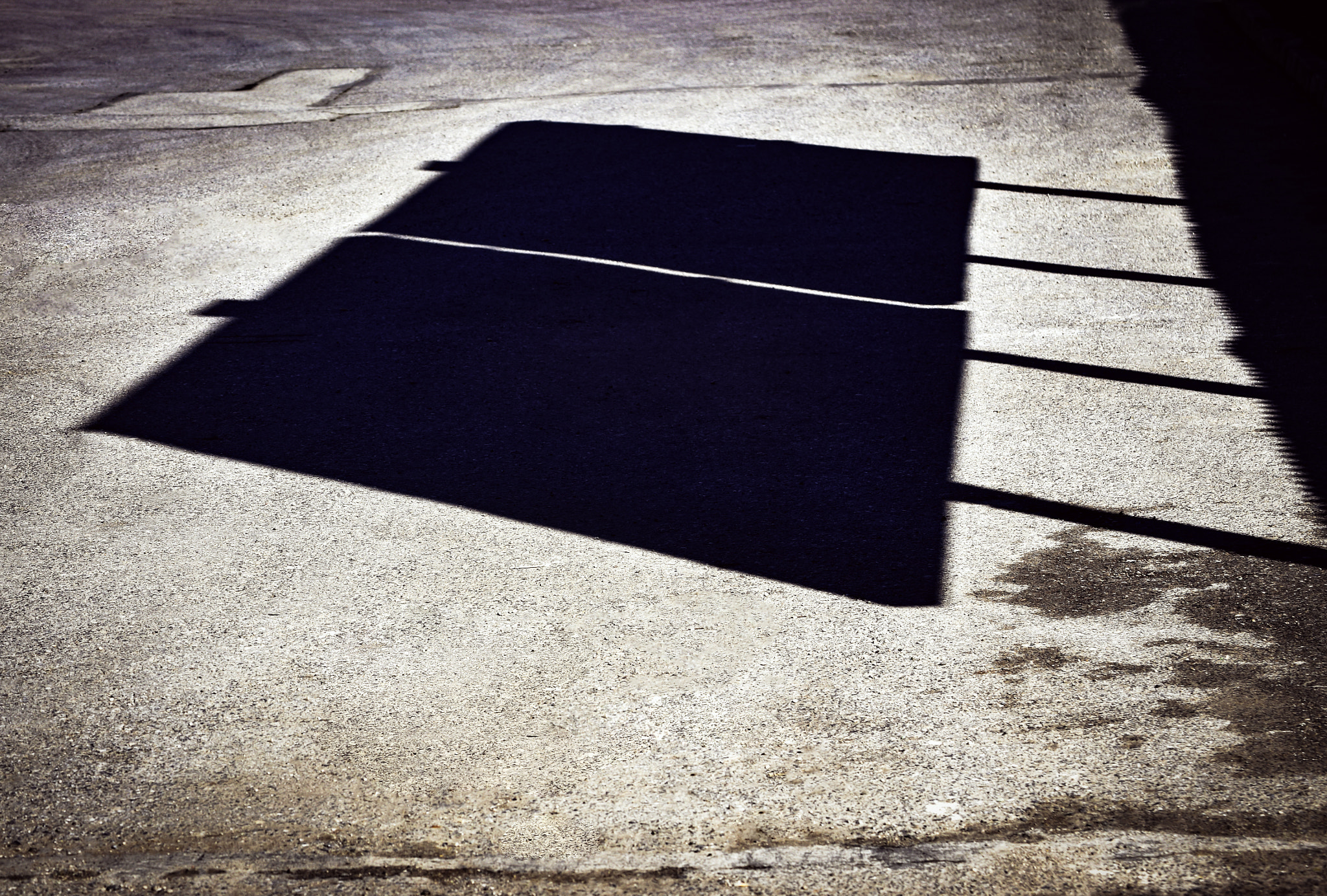Nikon D5500 sample photo. Shadow of billboards on the road photography